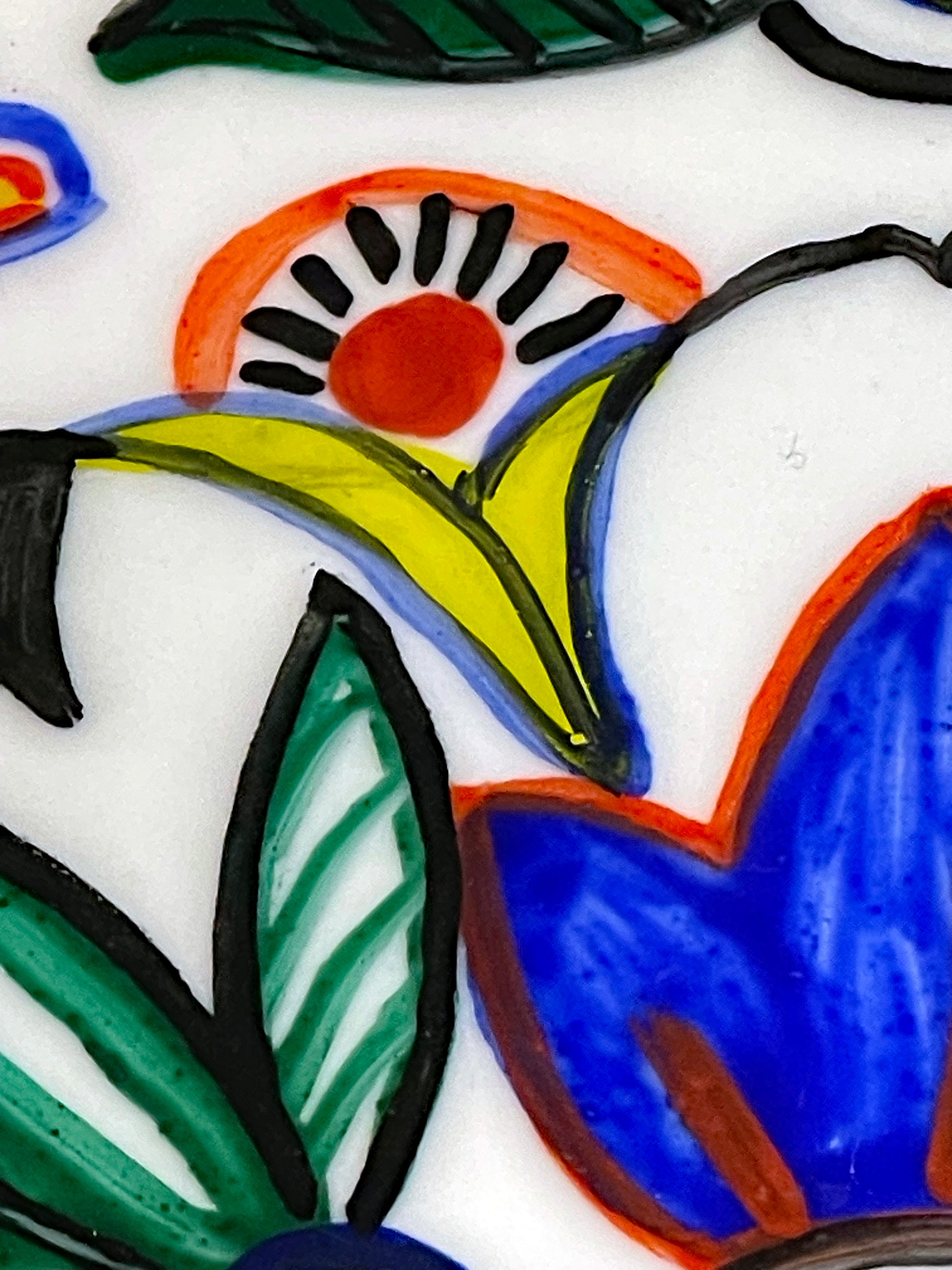 Close detail of a carnation sunburst and cobalt tulip