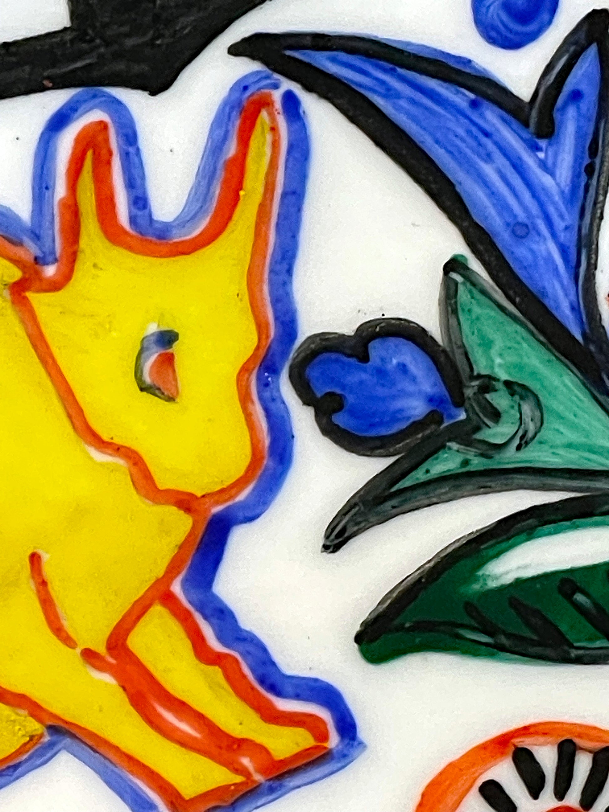 Detail of a hand-painted golden ox folk motif