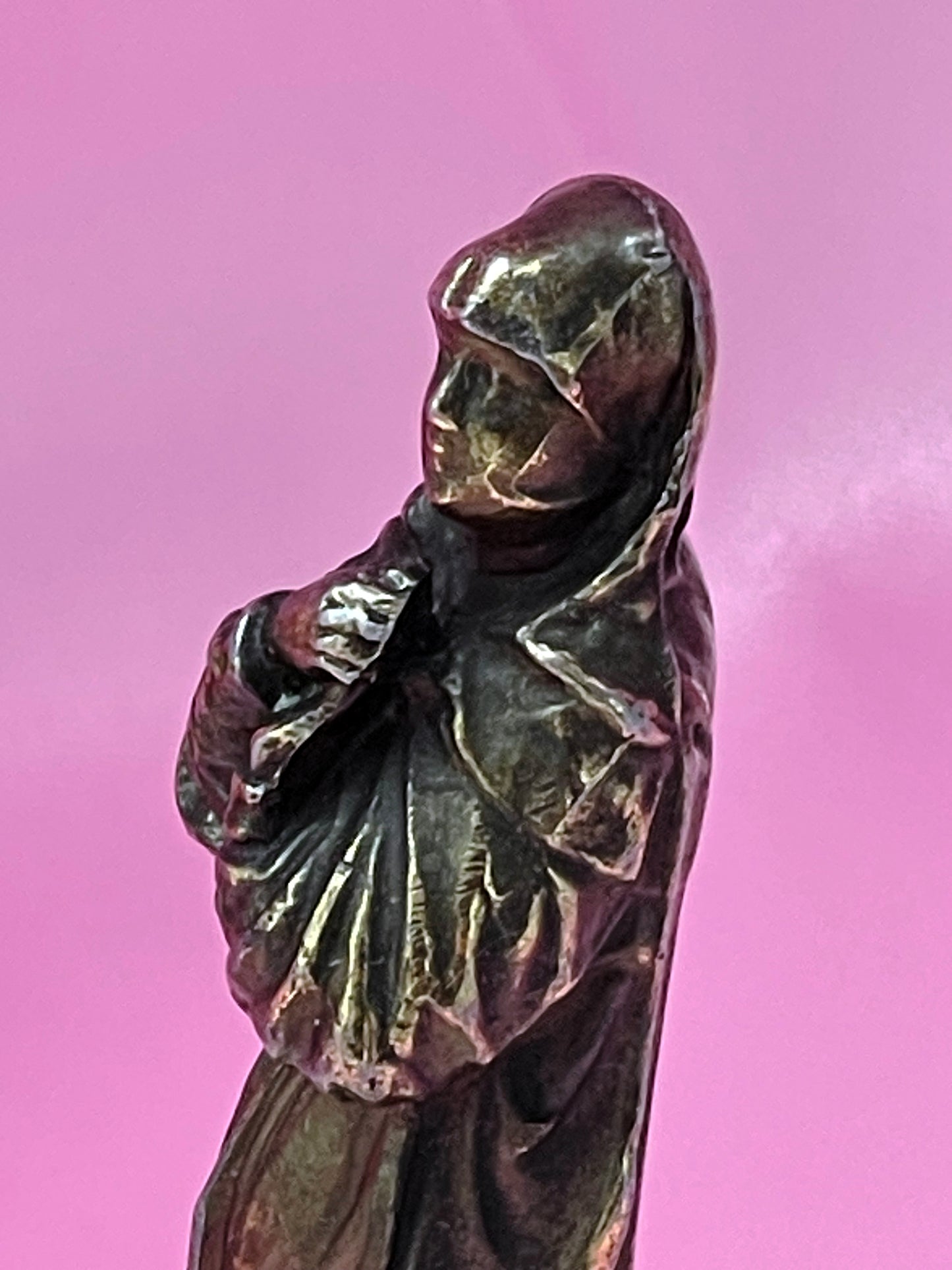 Bronze saint figure on white marble socle