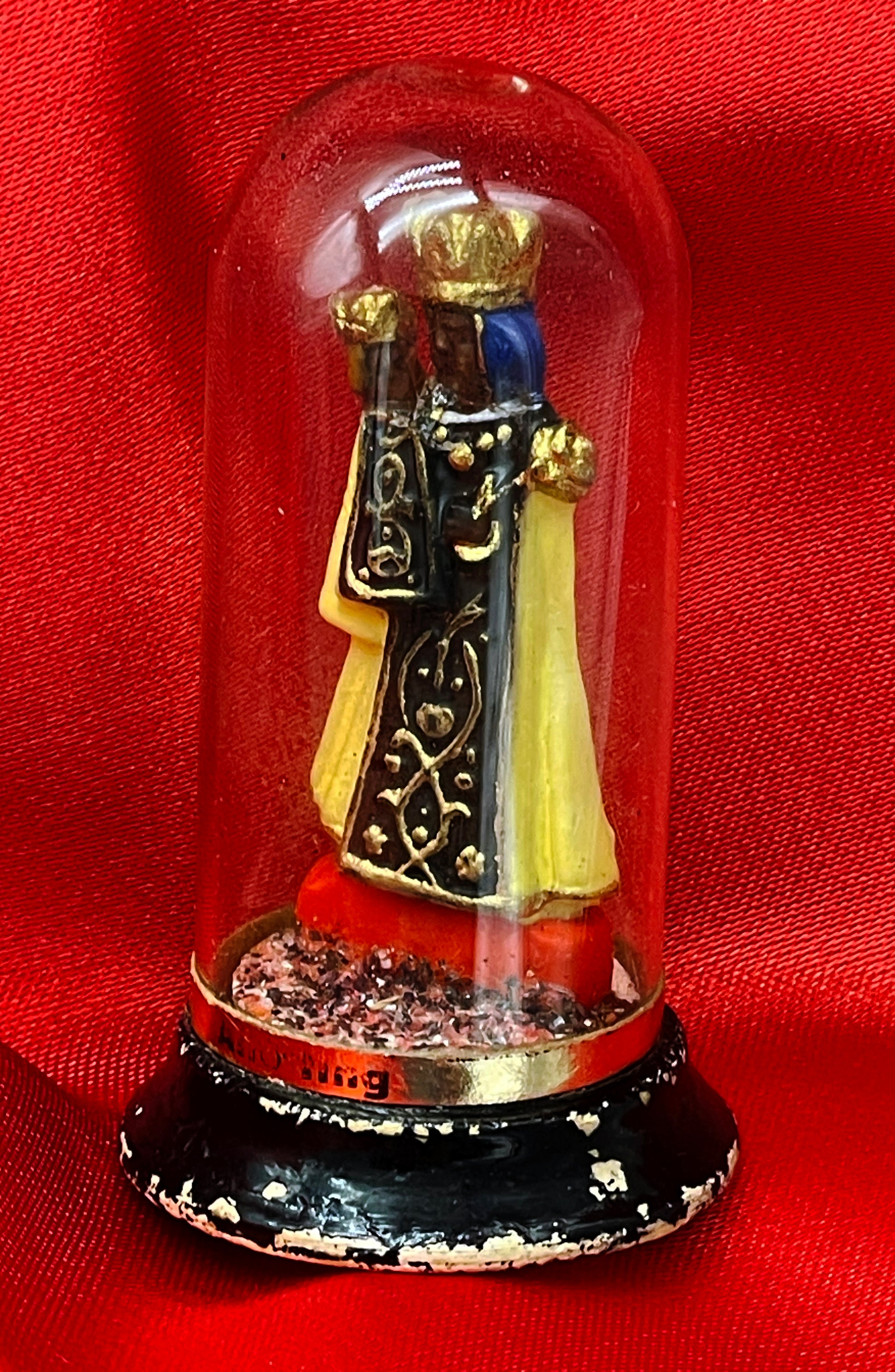 Black Madonna of Altotting devotional figure under glass dome