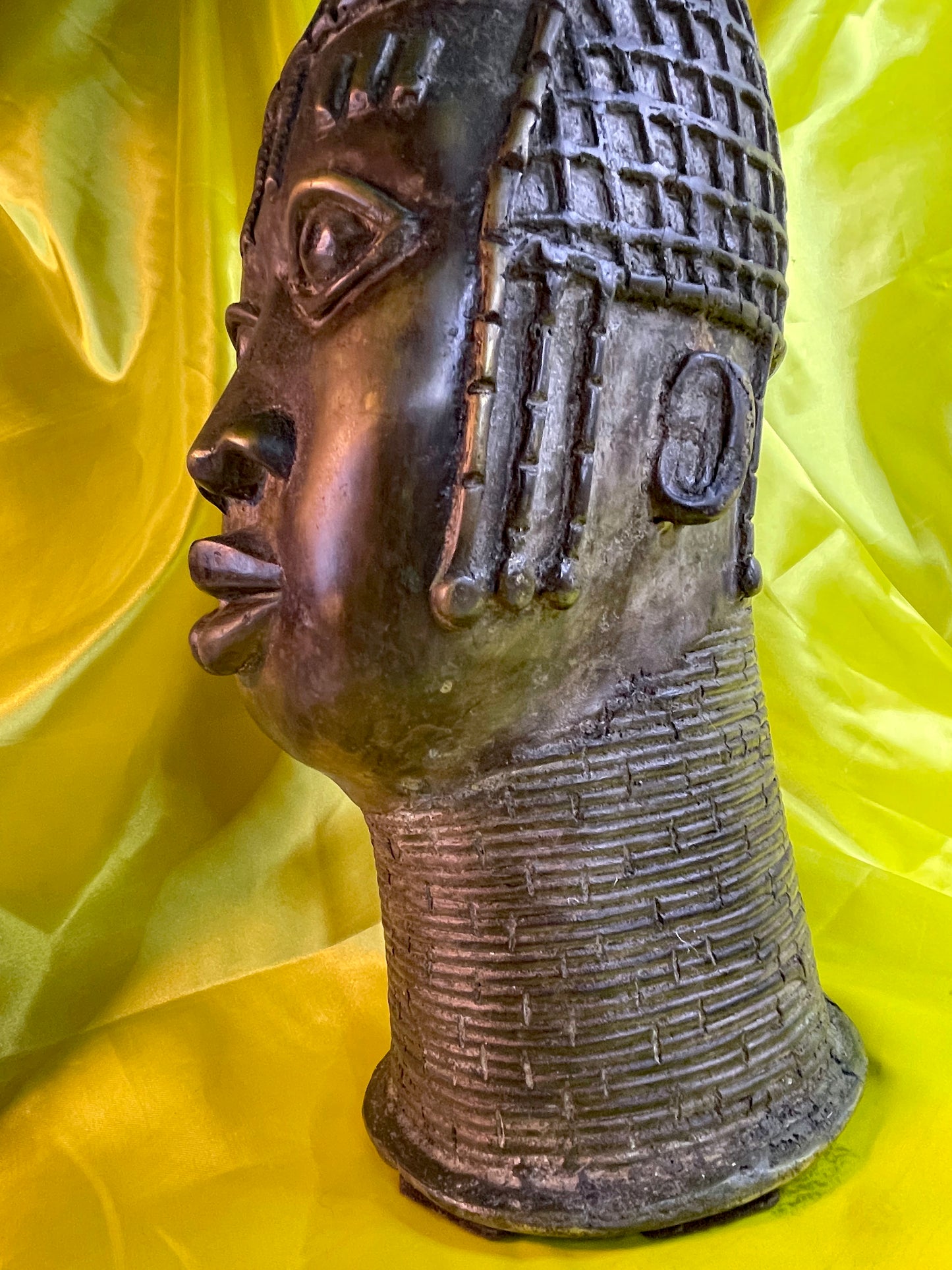 Side profile detail of the high coral bead collar and bead strands