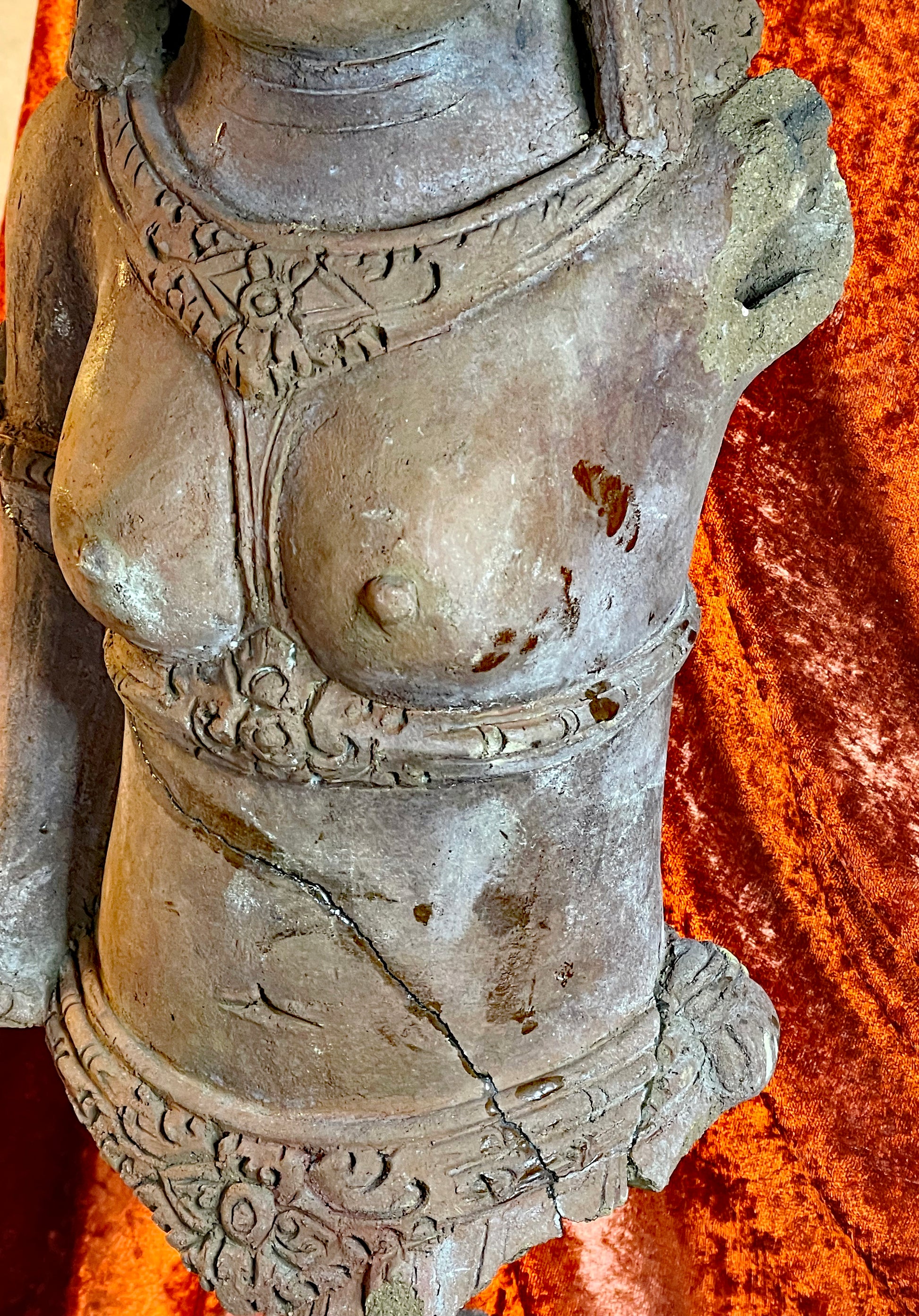 Weathered patina on antique Southeast Asian terracotta sculpture