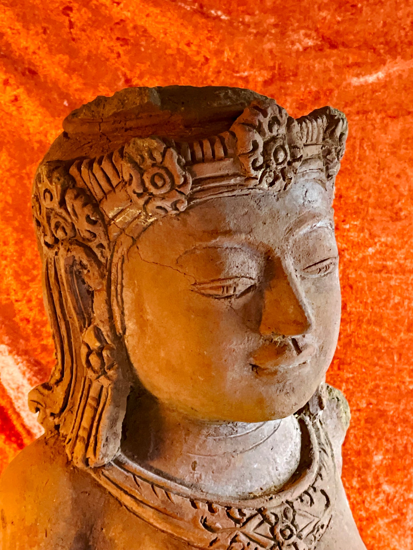 Sculpted belt detail on antique terracotta temple figure