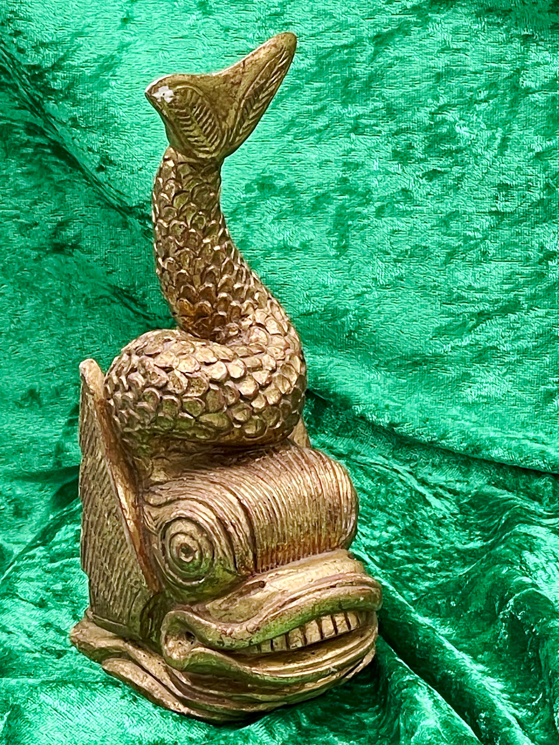 Golden carved wood fish figure detail