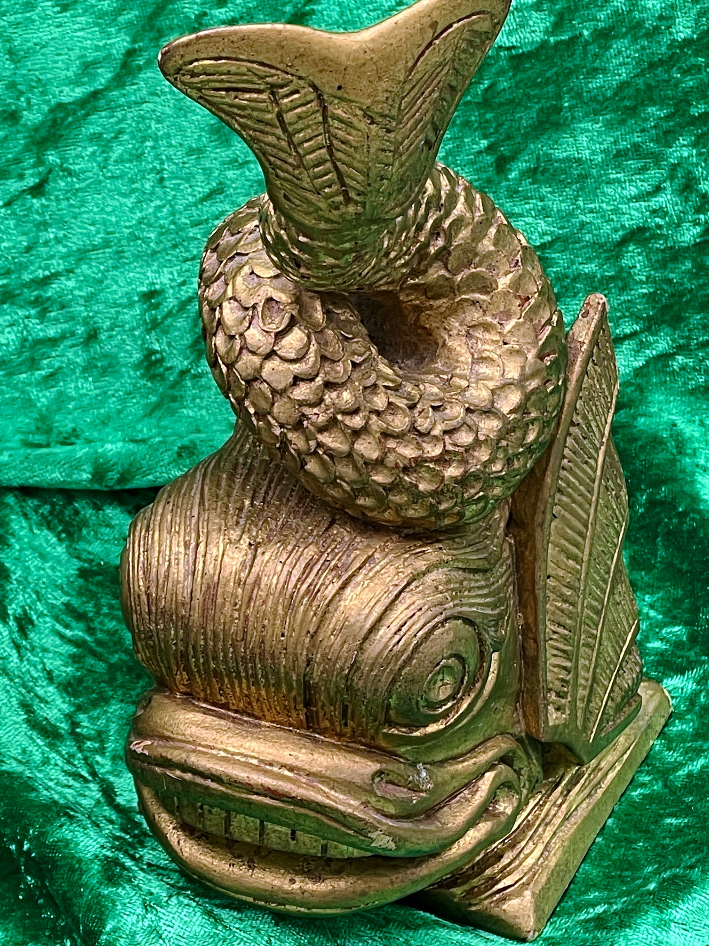 Decorative gilded fish sculpture angle view