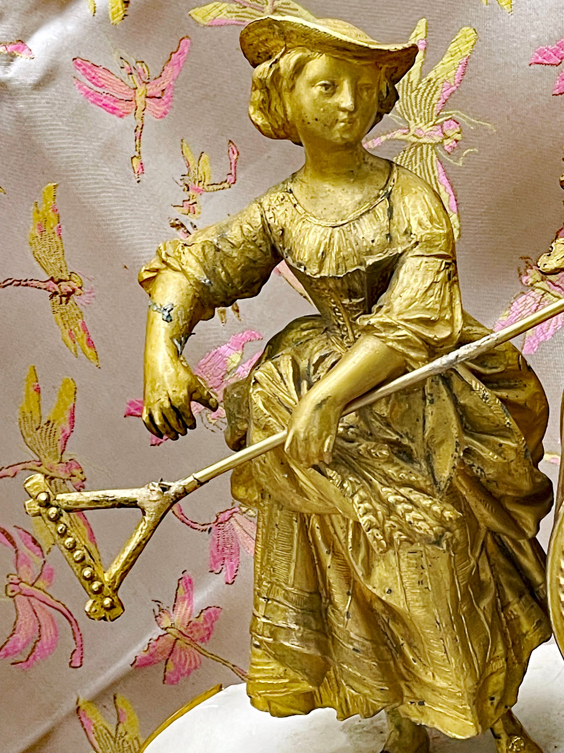 Detail of the ormolu decoration on the antique French clock