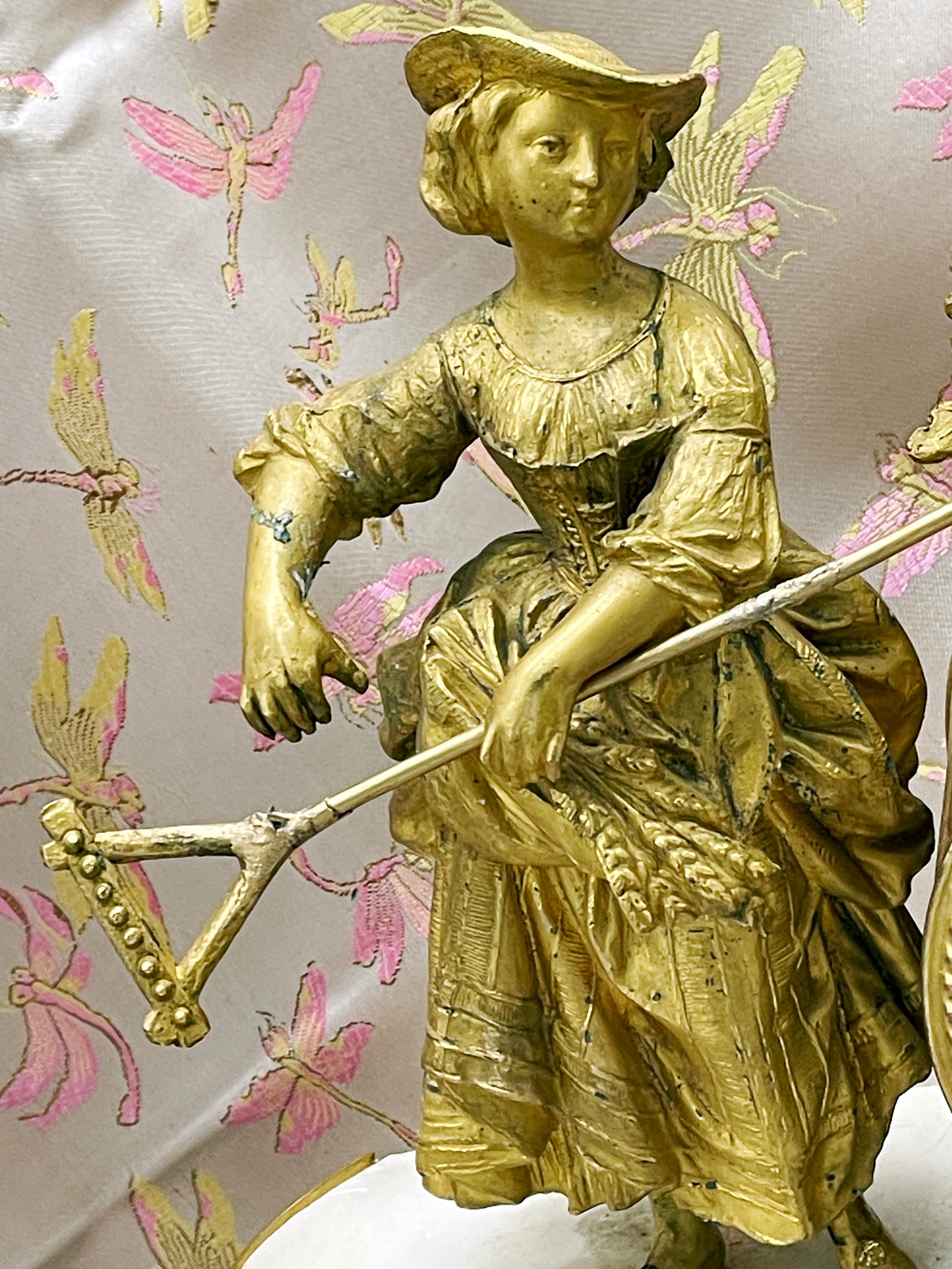 Close-up of the fire-gilt (ormolu) figure showing the costume and modelling