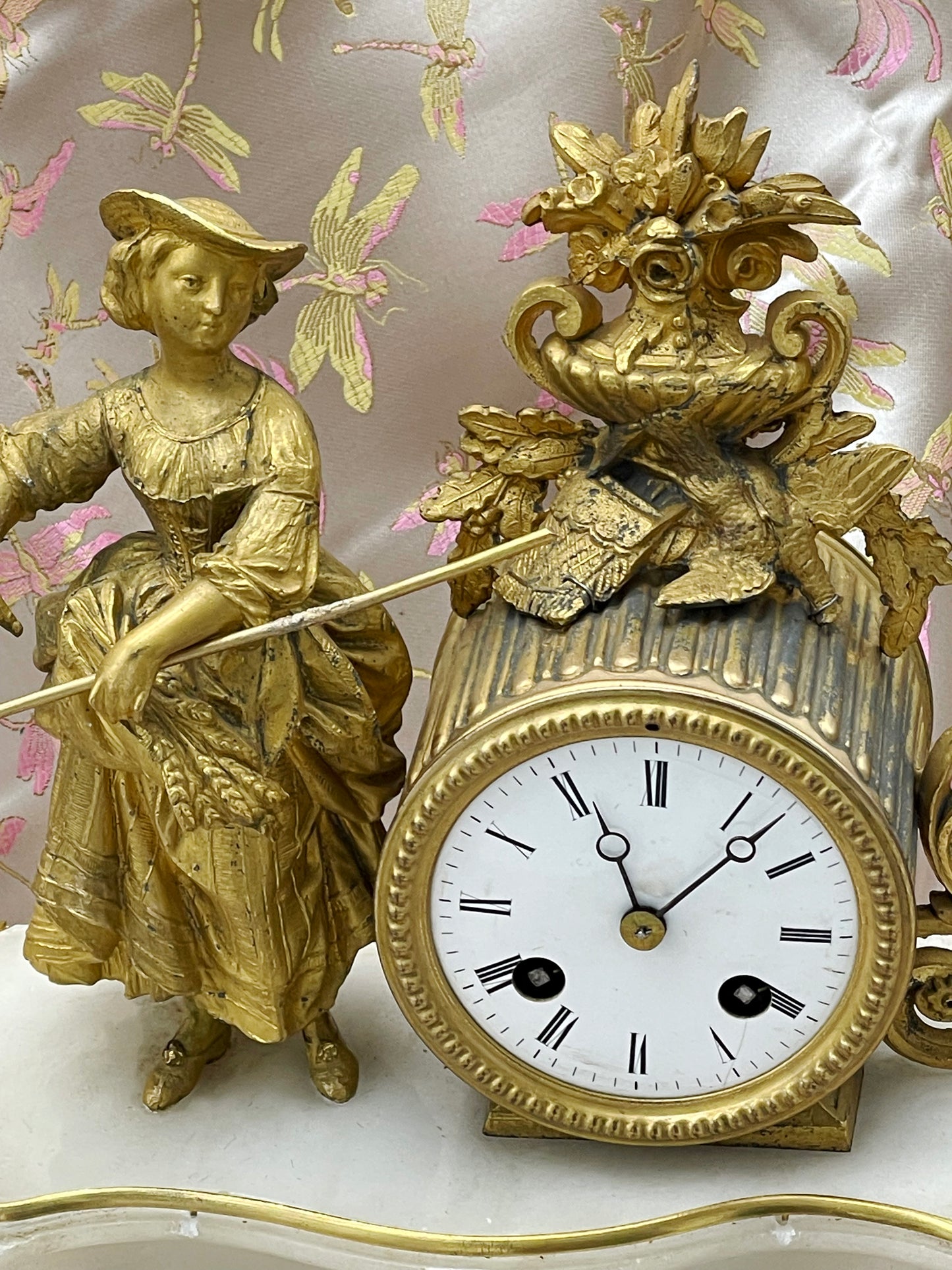 Detail of the fire-gilt bronze harvest maiden, enamel dial and ormolu urn with dome removed