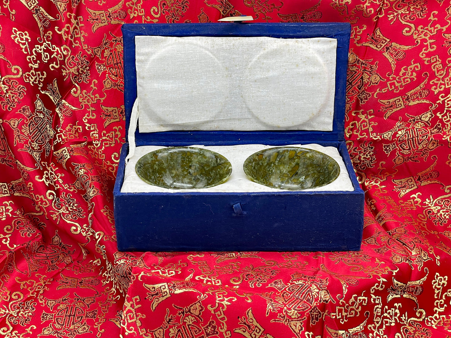 Two finely carved Chinese jade bowls with presentation box