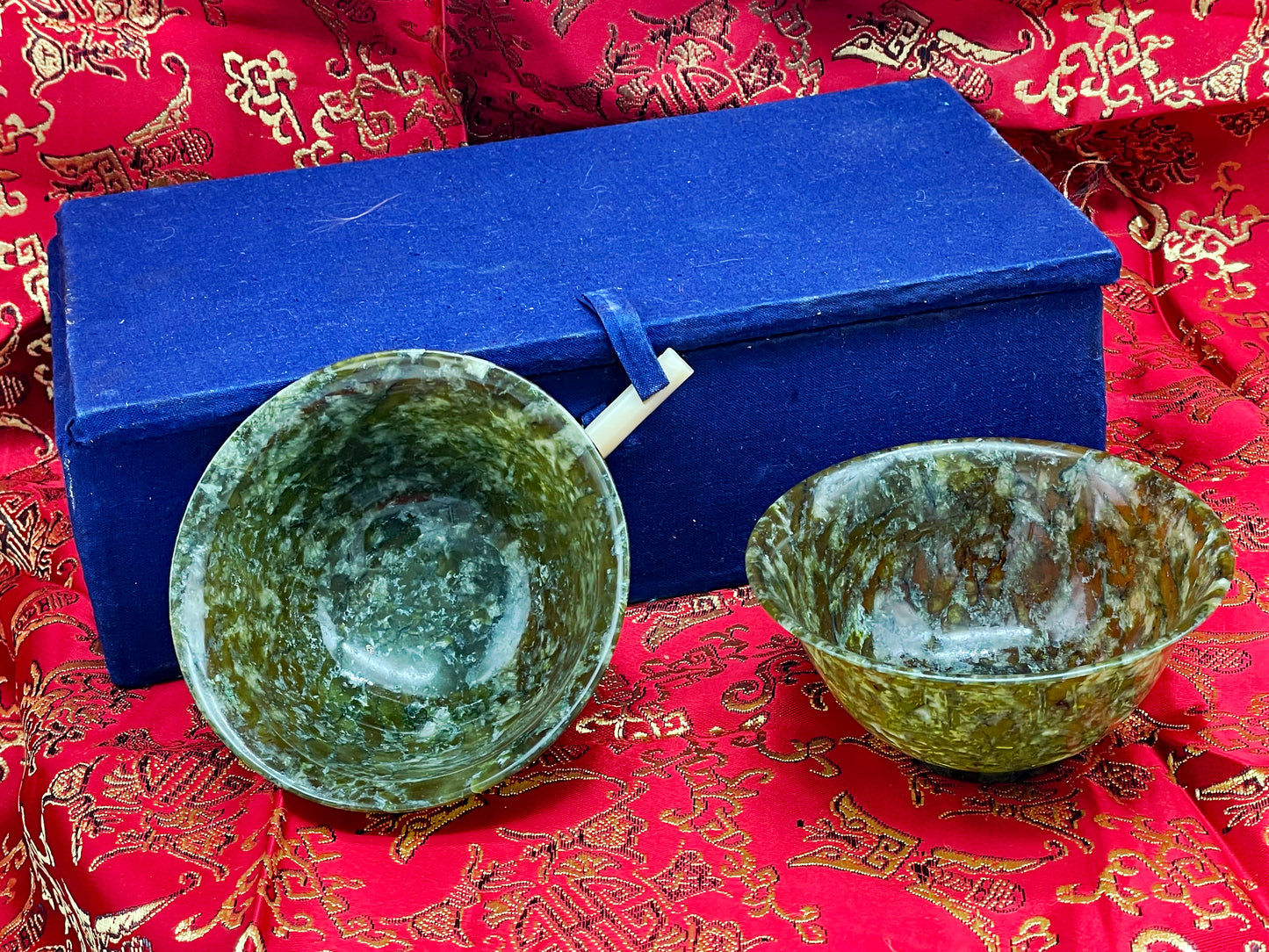 Pair of carved translucent jade bowls from China with blue gift box