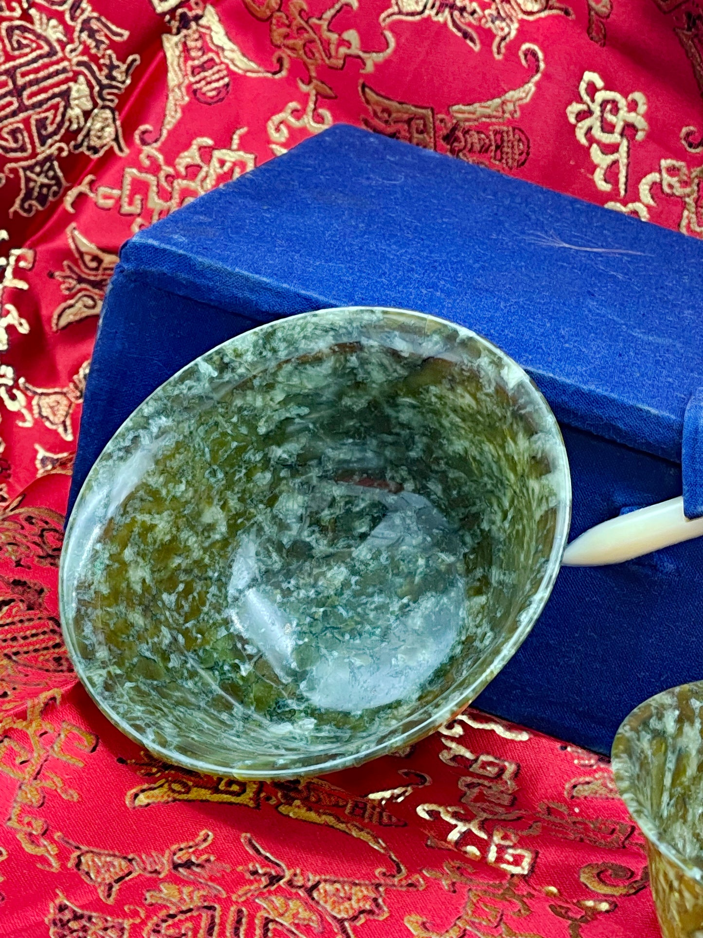 Carved jade bowl interior showing natural stone mottling