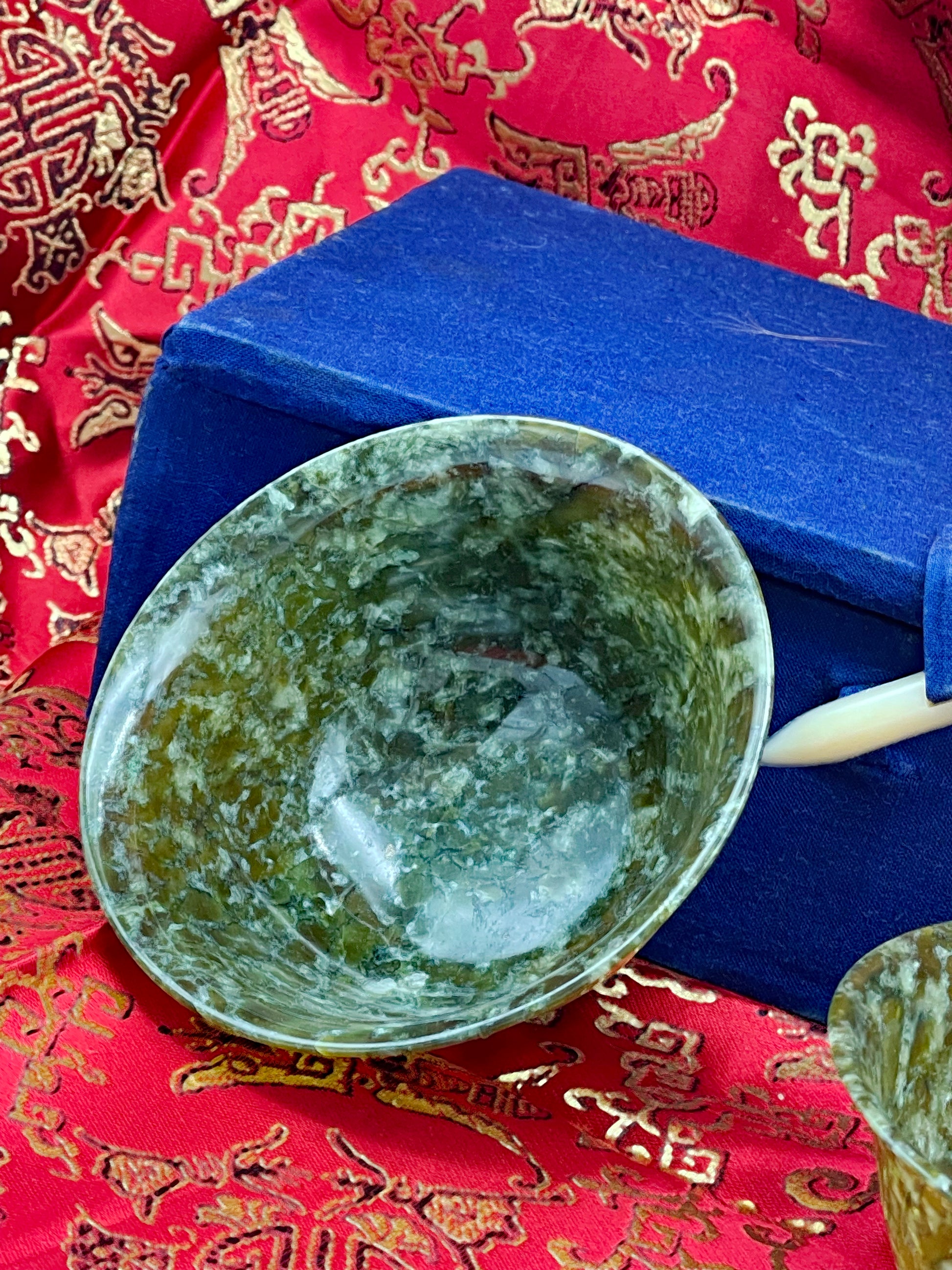 Carved jade bowl interior showing natural stone mottling