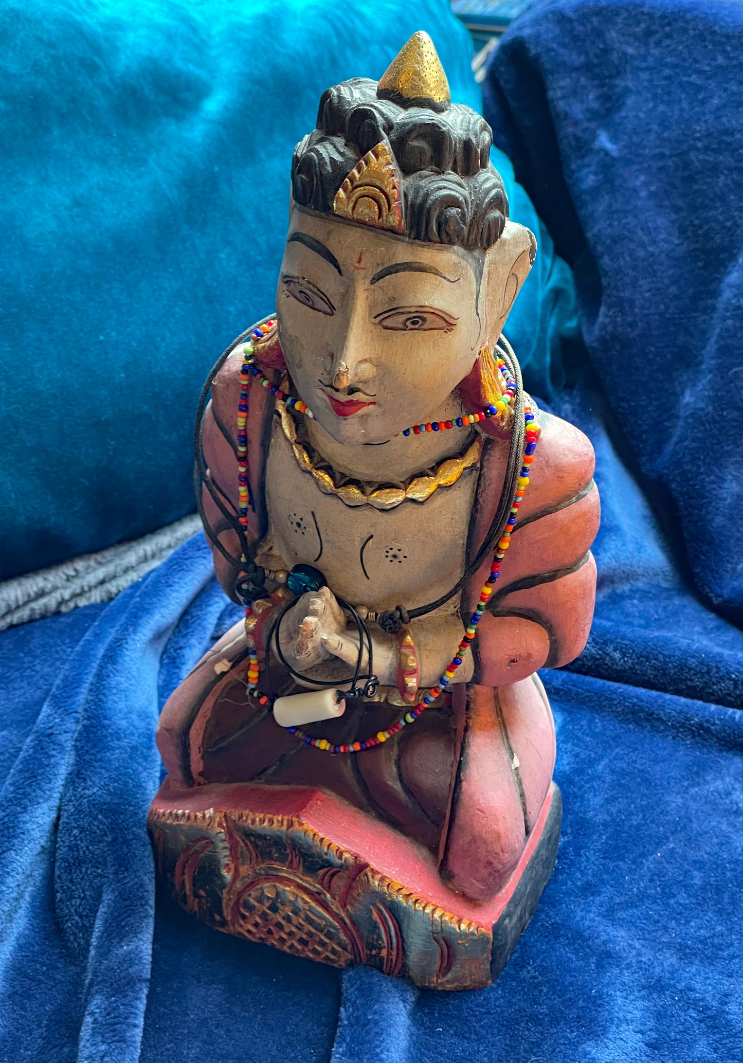 Indian wooden devotional figure with colourful glass beads