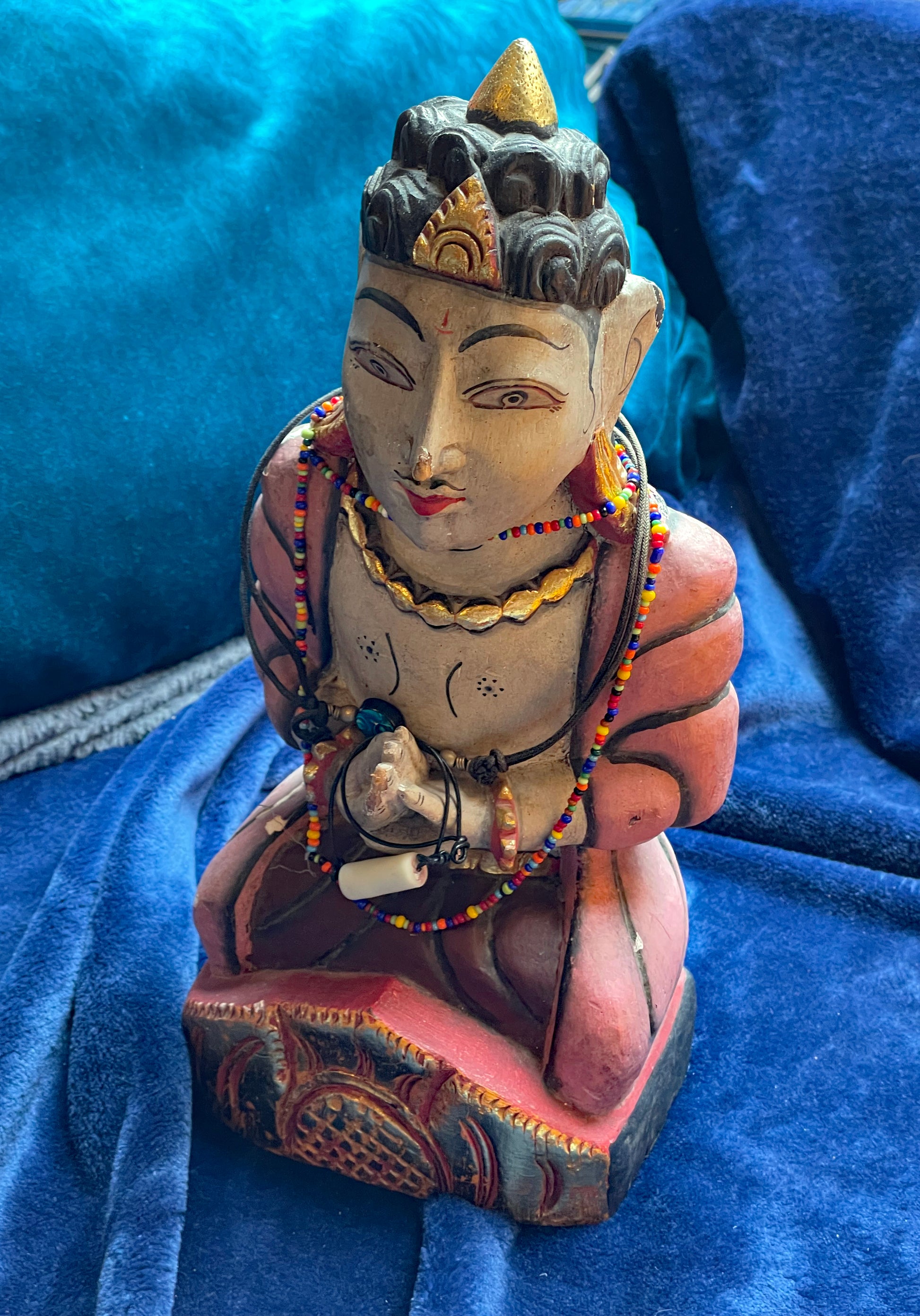 Indian wooden devotional figure with colourful glass beads