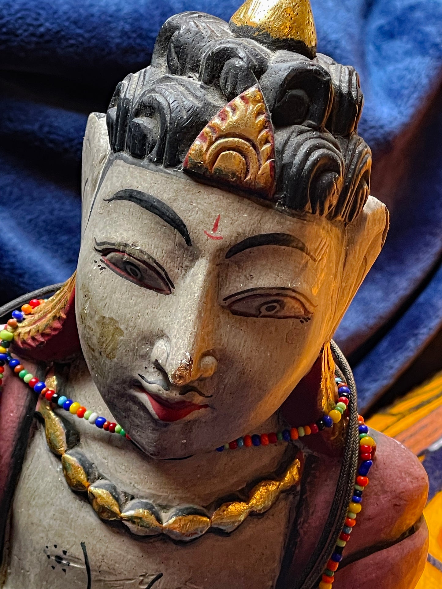Indian folk wooden sculpture in prayer pose