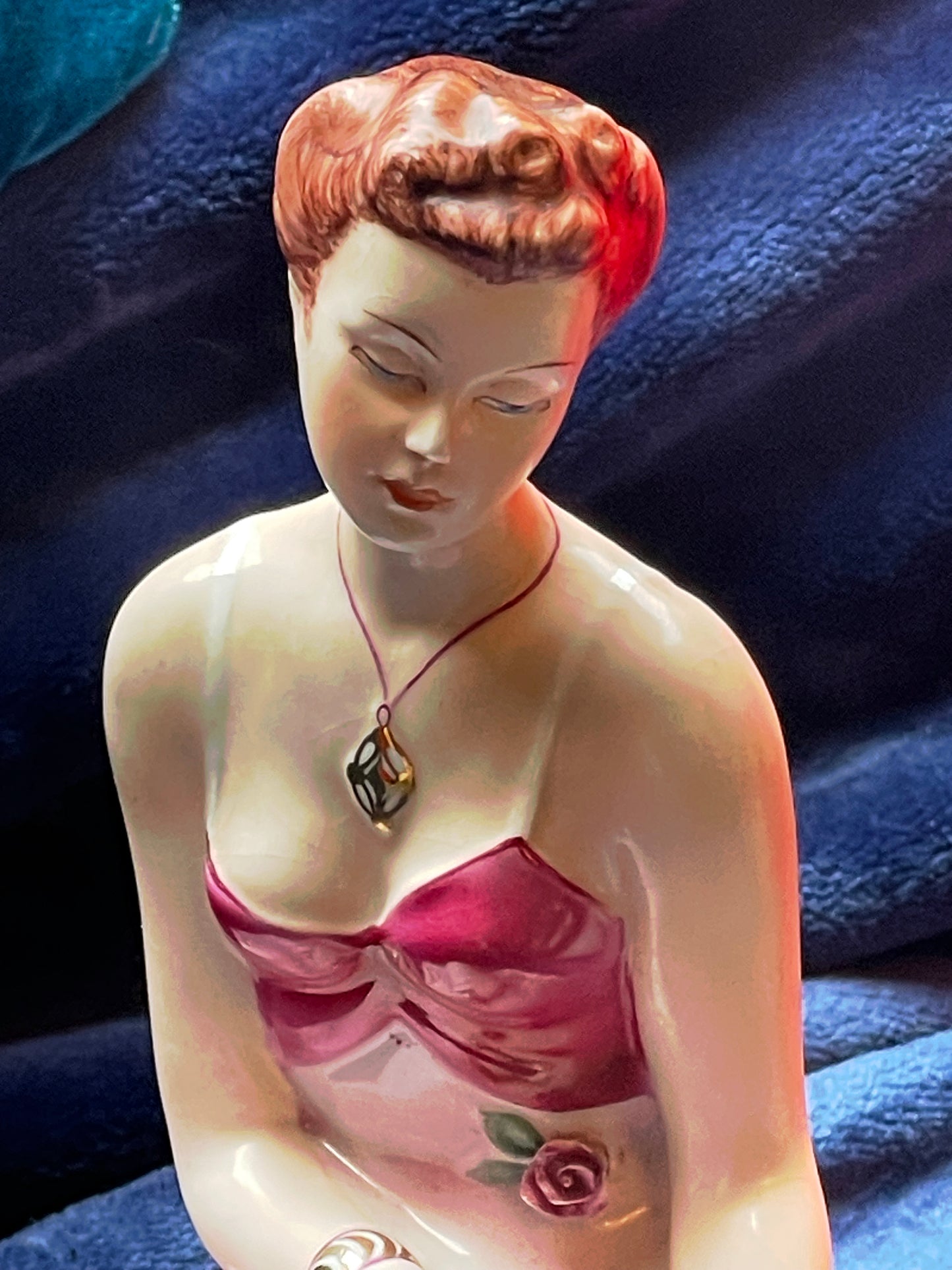 Porcelain ballerina figurine side profile with gilded details