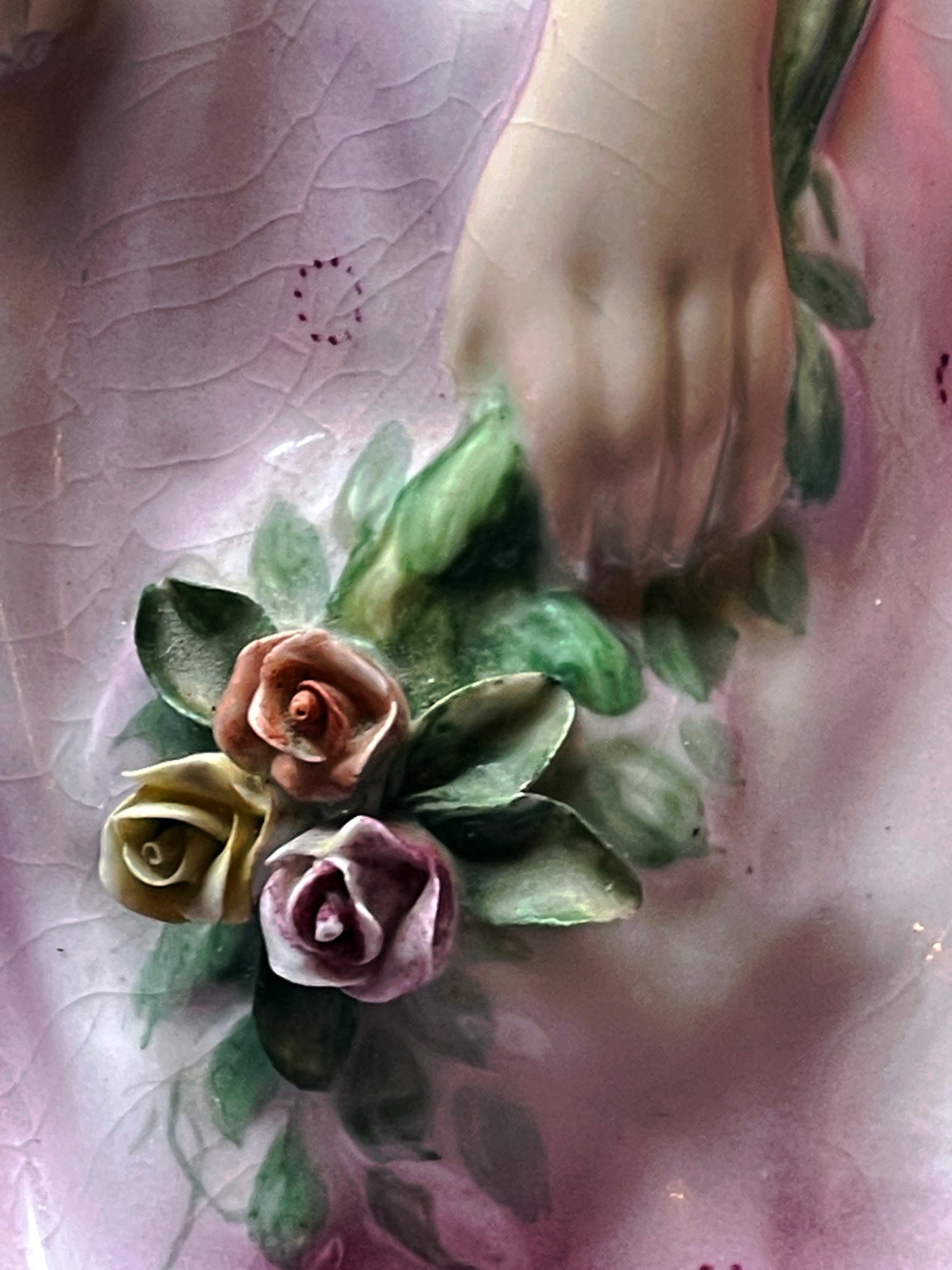 Gilded slippers detail on porcelain ballerina figurine