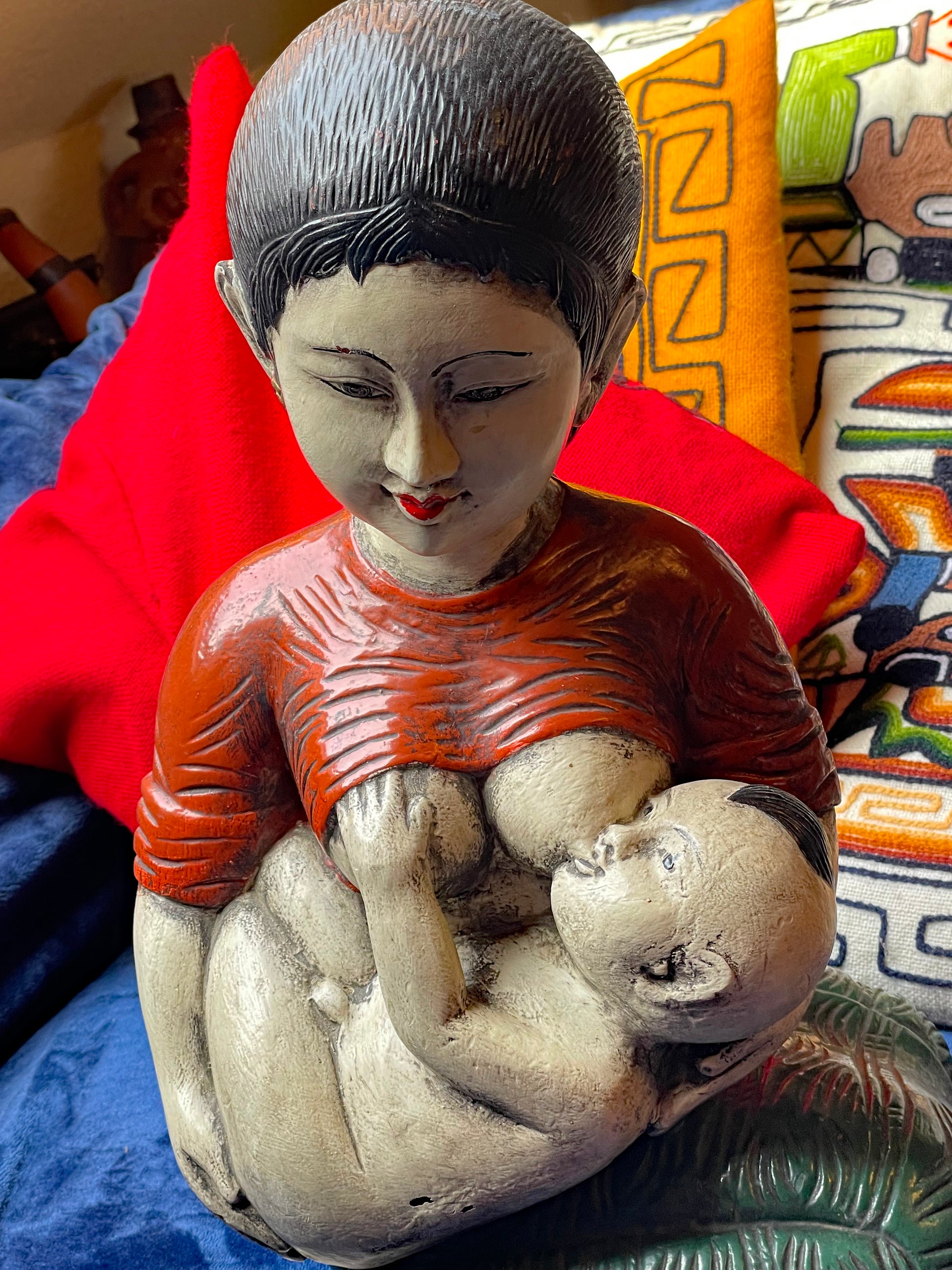 Hand-carved green sarong detail of Japanese figure