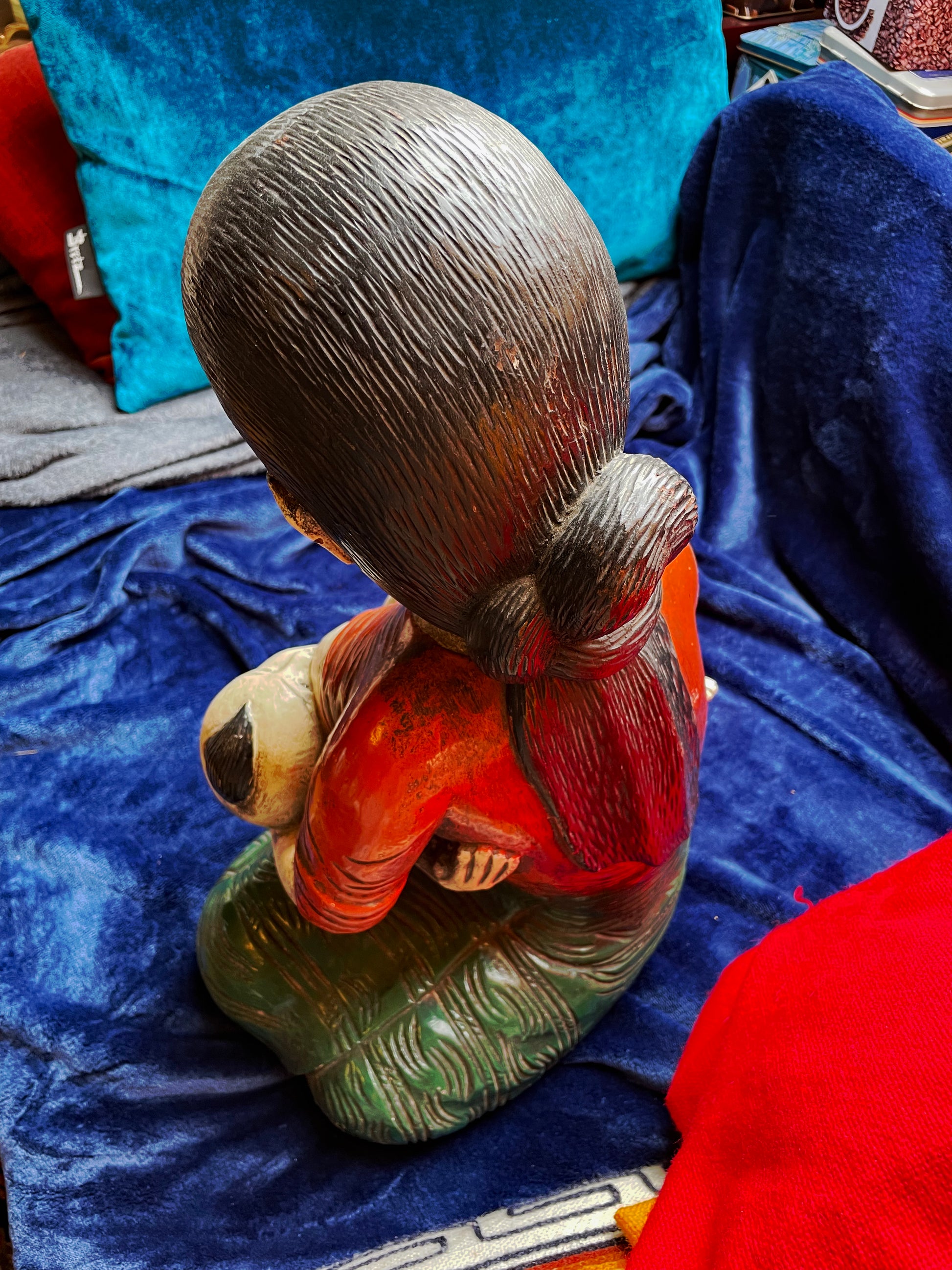 Carved facial expression of the mother figure