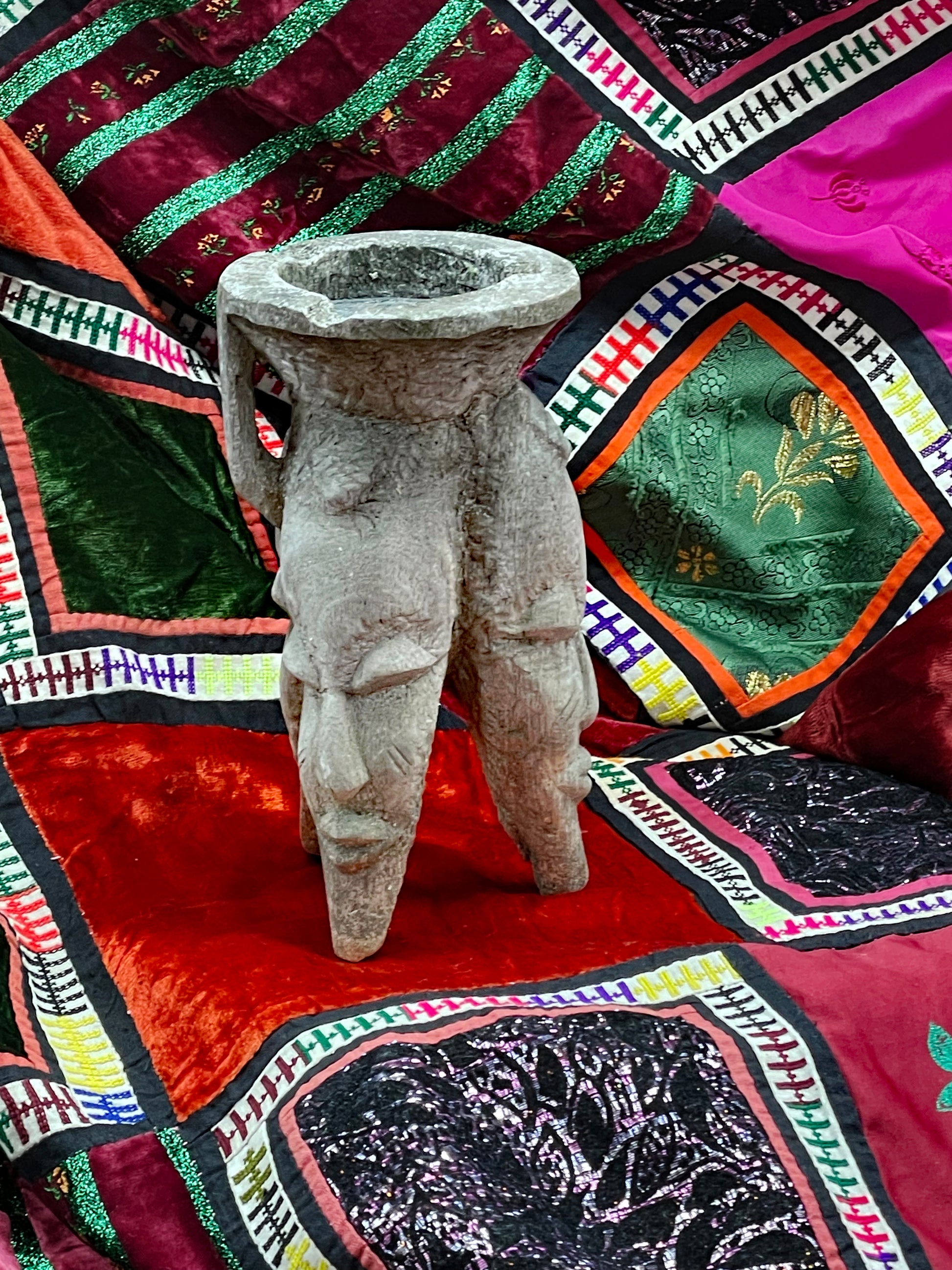 Tribal carved wooden incense vessel with three figural feet and aged grey patina