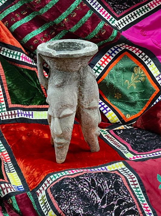 Tribal carved wooden incense vessel with three figural feet and aged grey patina