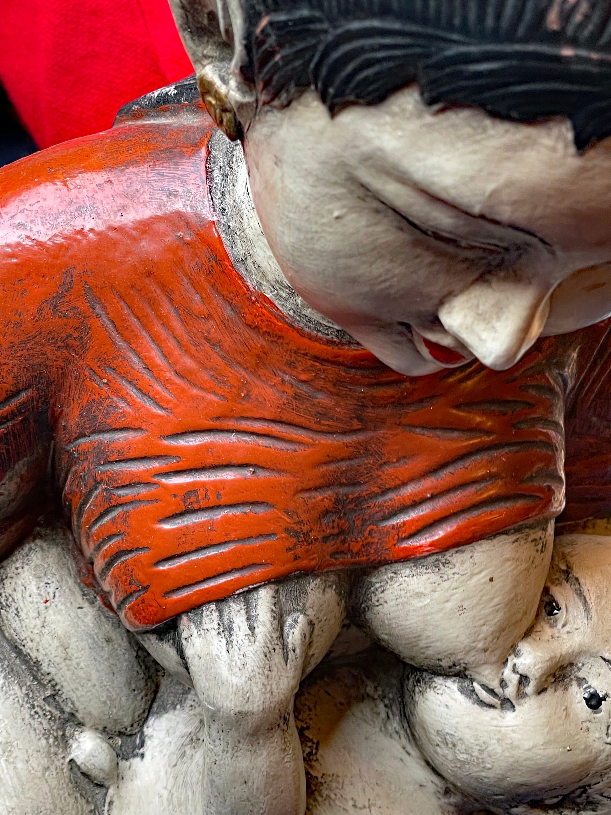 Base and seated posture of the wooden figure