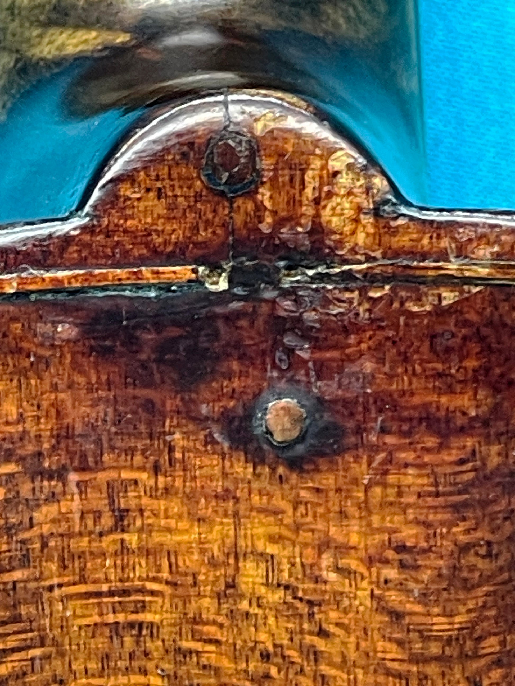 Antique violin back view with wood grain