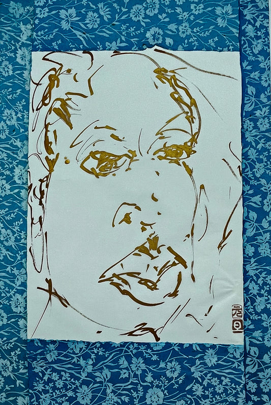 Original gold-ink portrait drawing of a face on cream paper, full view on blue ground