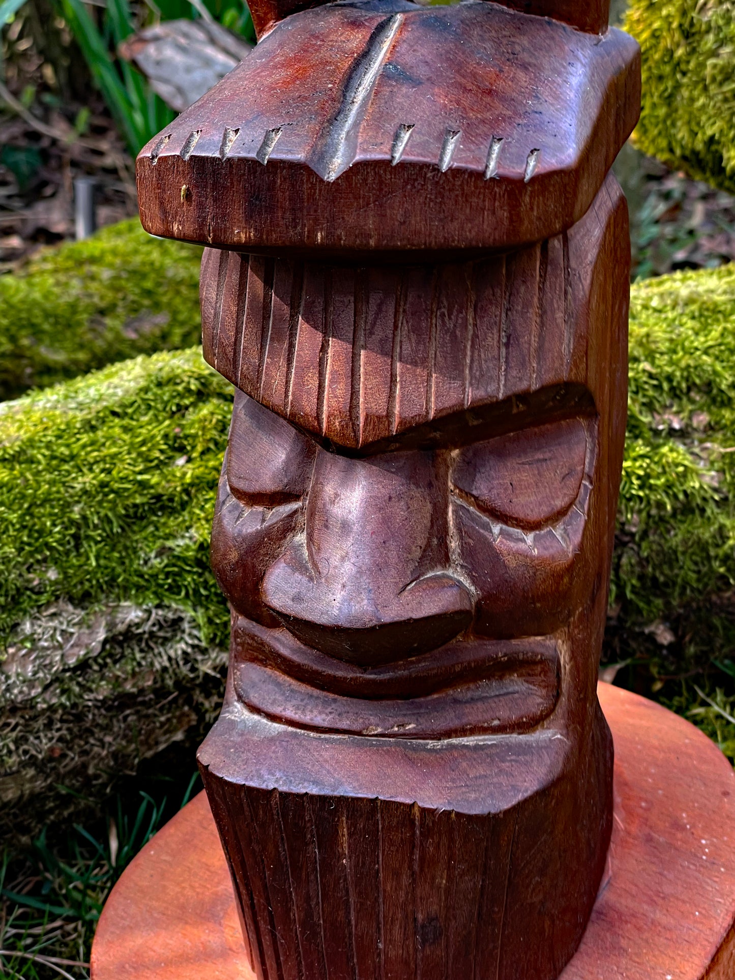 Detail of the secondary guardian spirit head carved at the base
