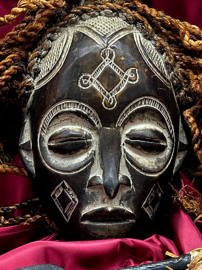 Mid-20th Century Chokwe Mask with Raffia Braids and Ceremonial Iron Arrow – Likely Congo