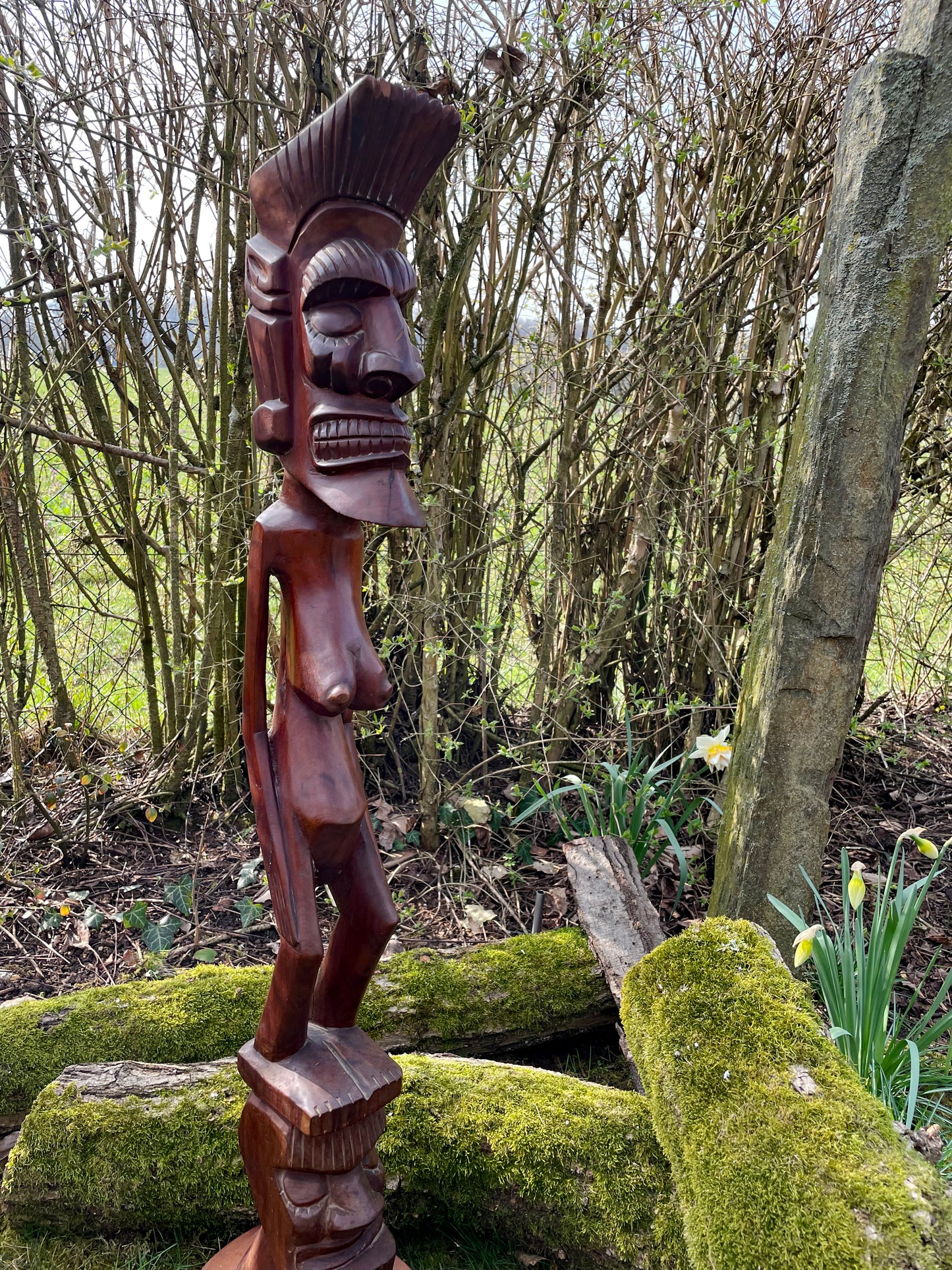 Lobi bateba spirit figure three-quarter angle showing carved body and crest