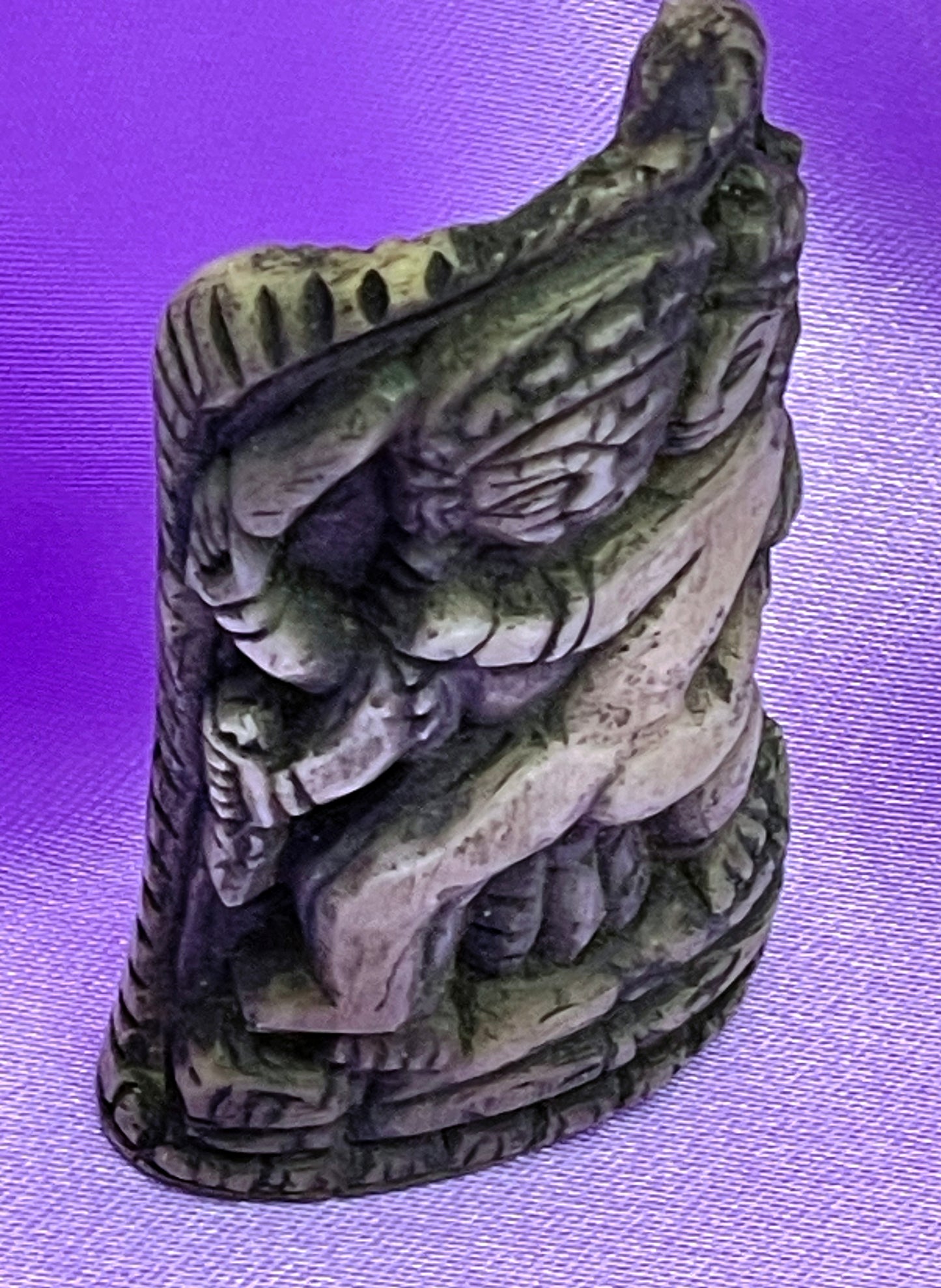 Side view of Indian bone carving showing patina