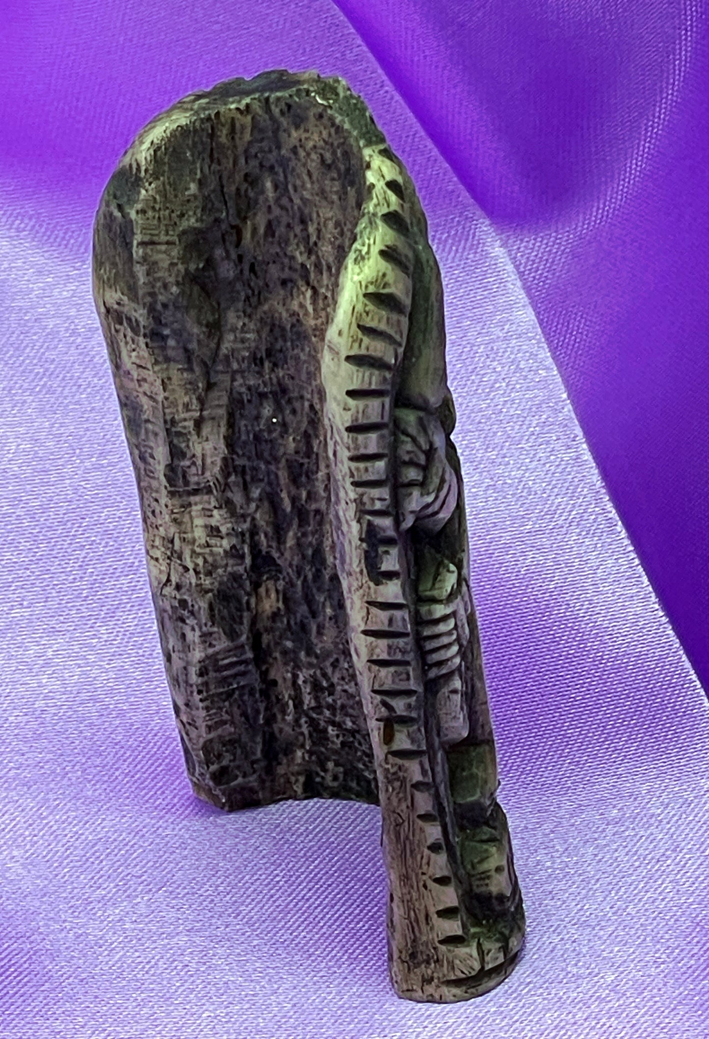 Close-up of the embracing figures on the bone plaque