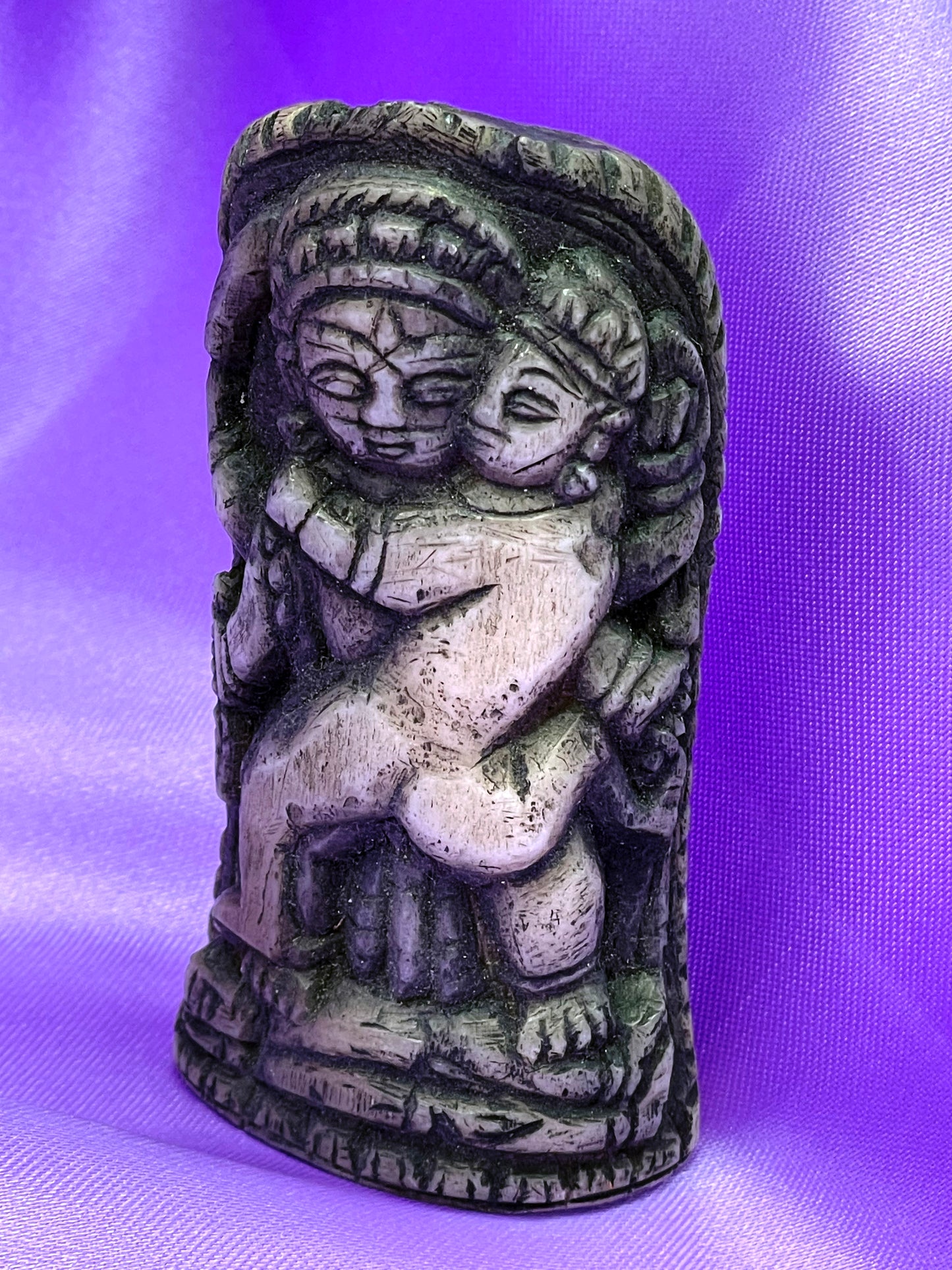 Bone carving detail showing temple arch