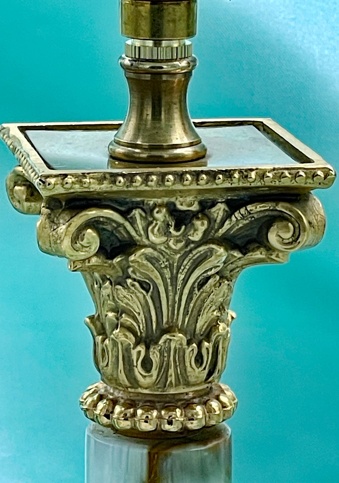 White marble column and base detail of the Art Deco lamp