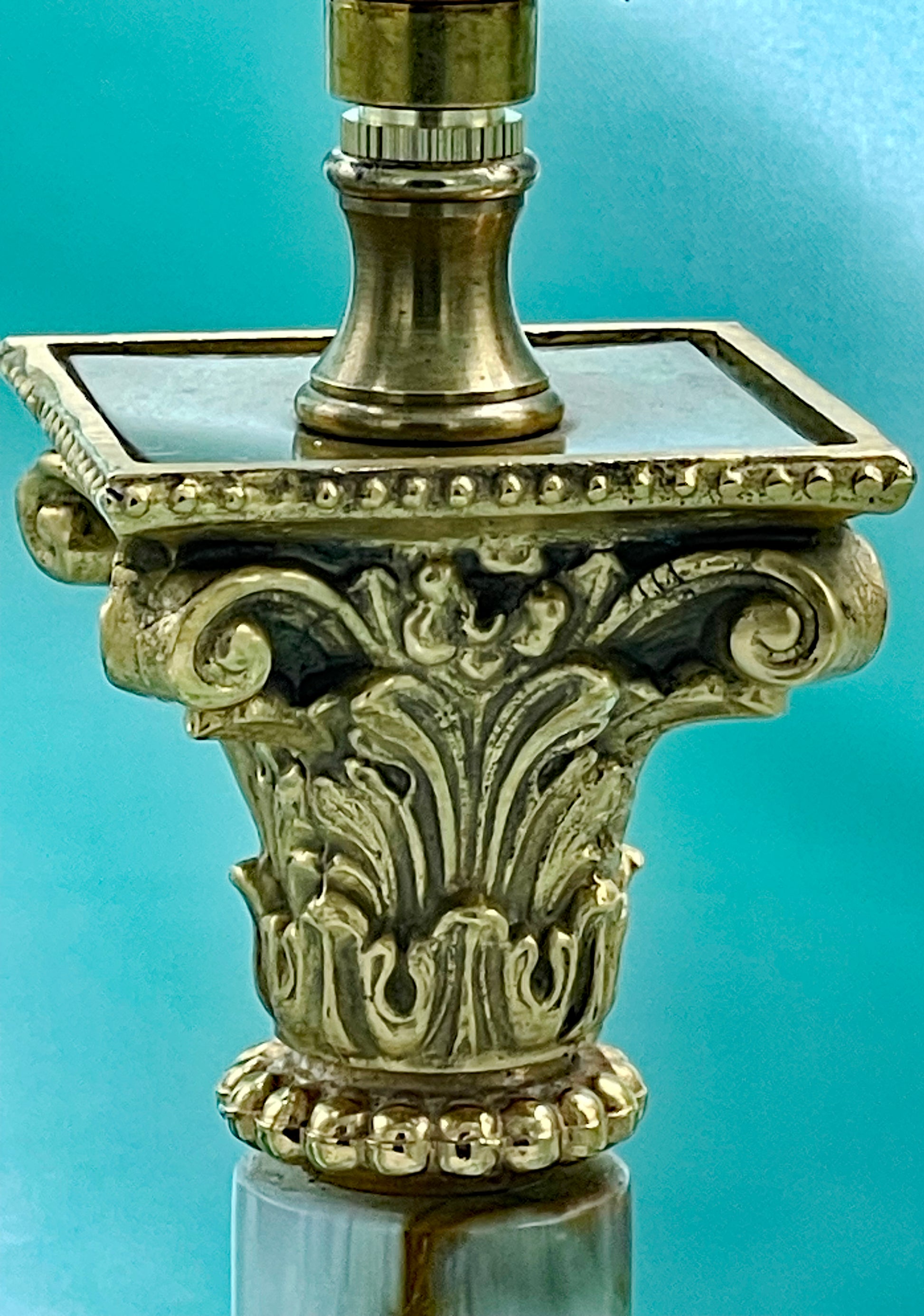 White marble column and base detail of the Art Deco lamp