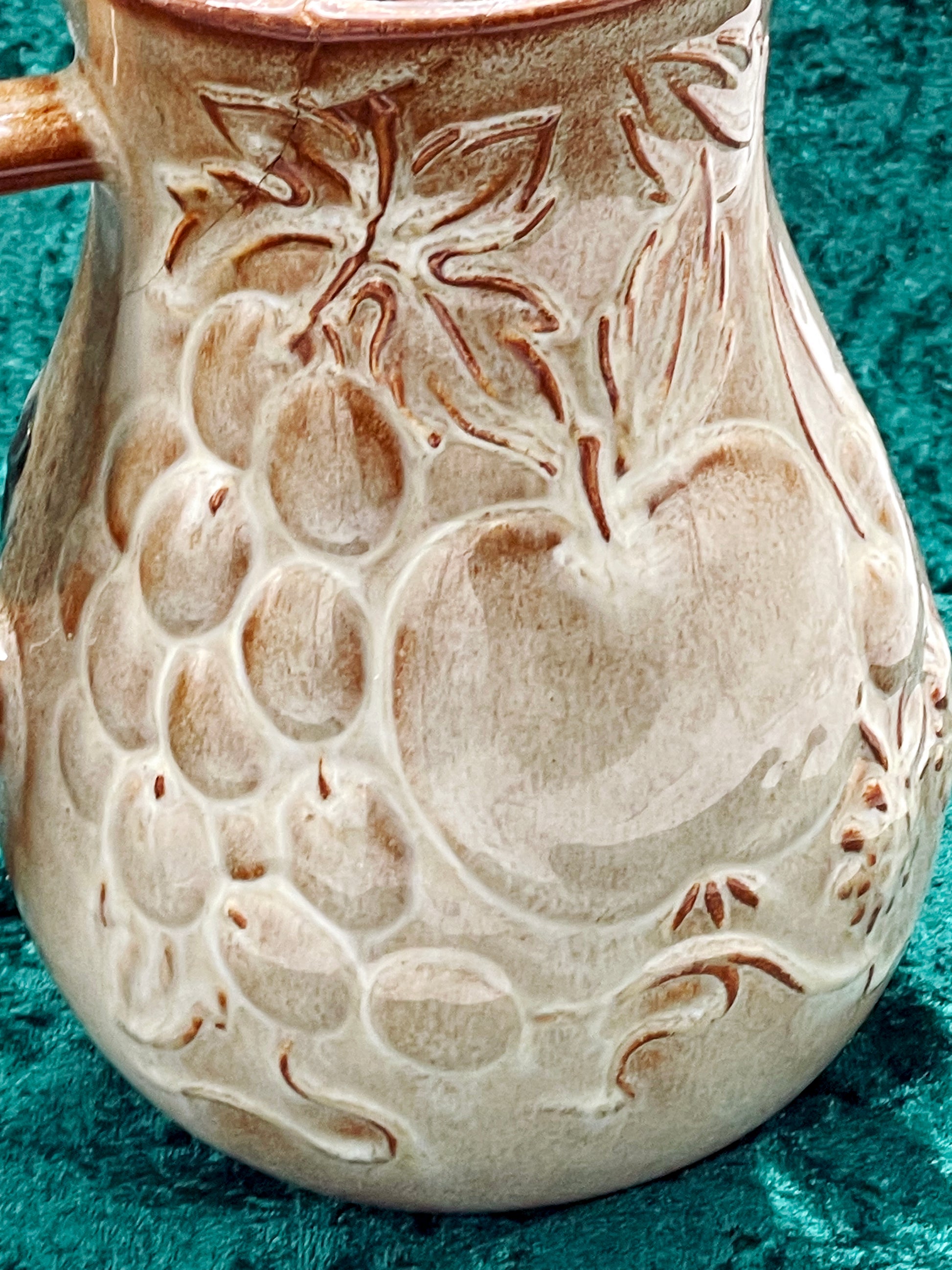 Close view of the undecorated cream-glazed relief on the reverse