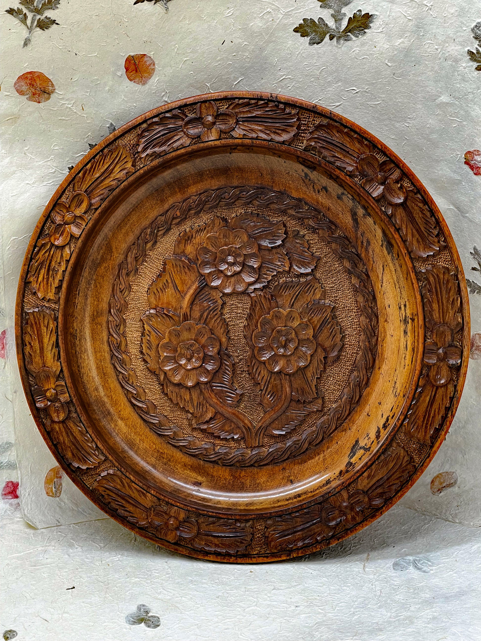Reverse of hand-carved wooden plate