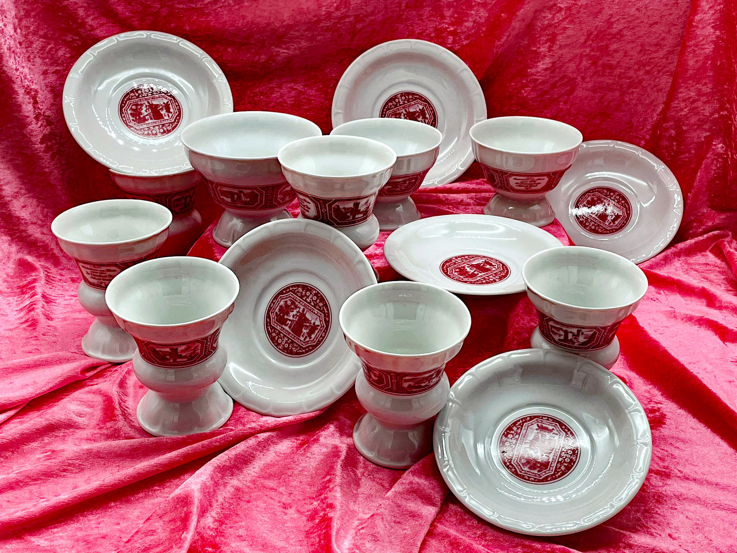 Detail of red Rüdesheim transferware on white porcelain
