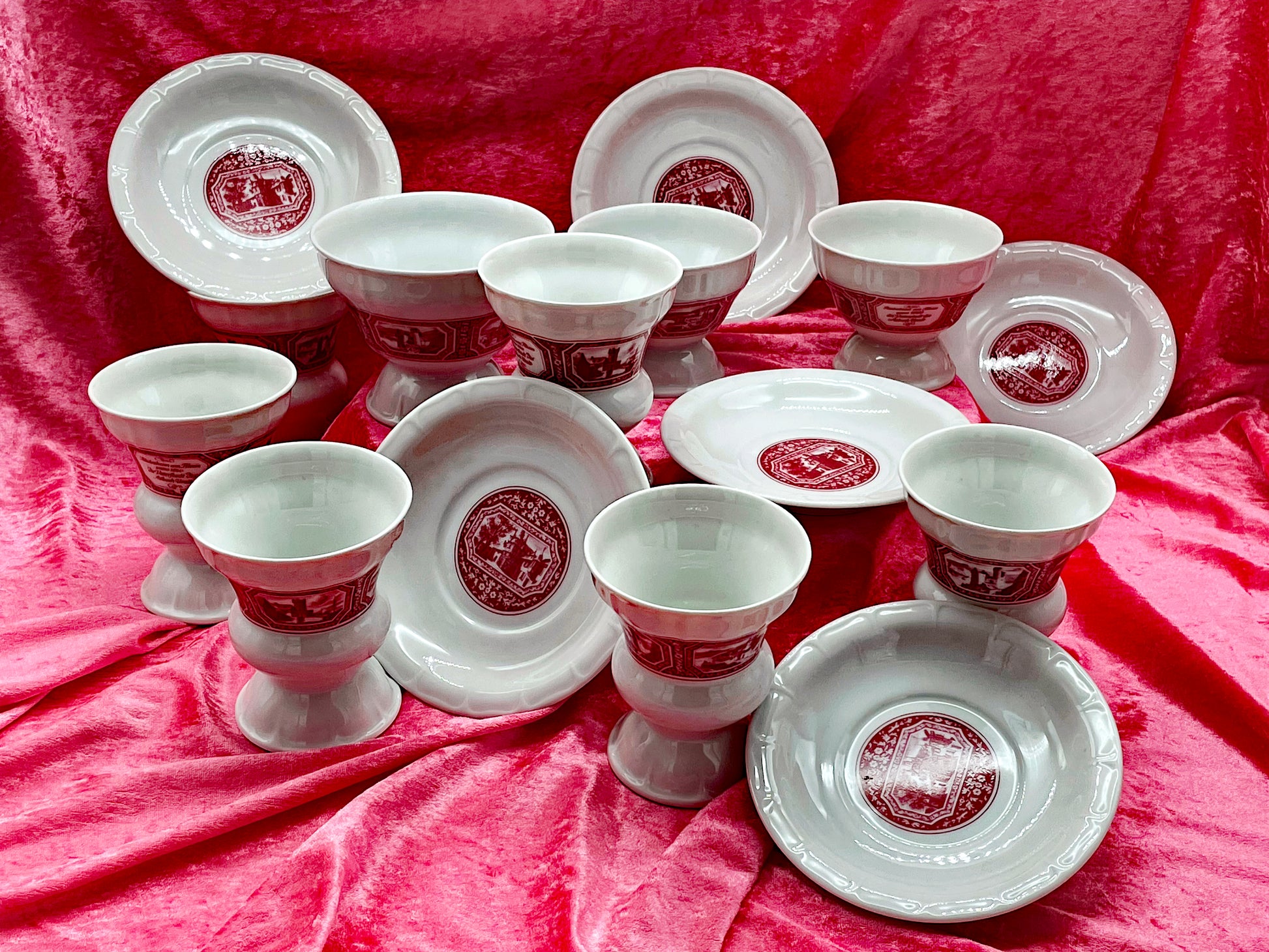 Detail of red Rüdesheim transferware on white porcelain