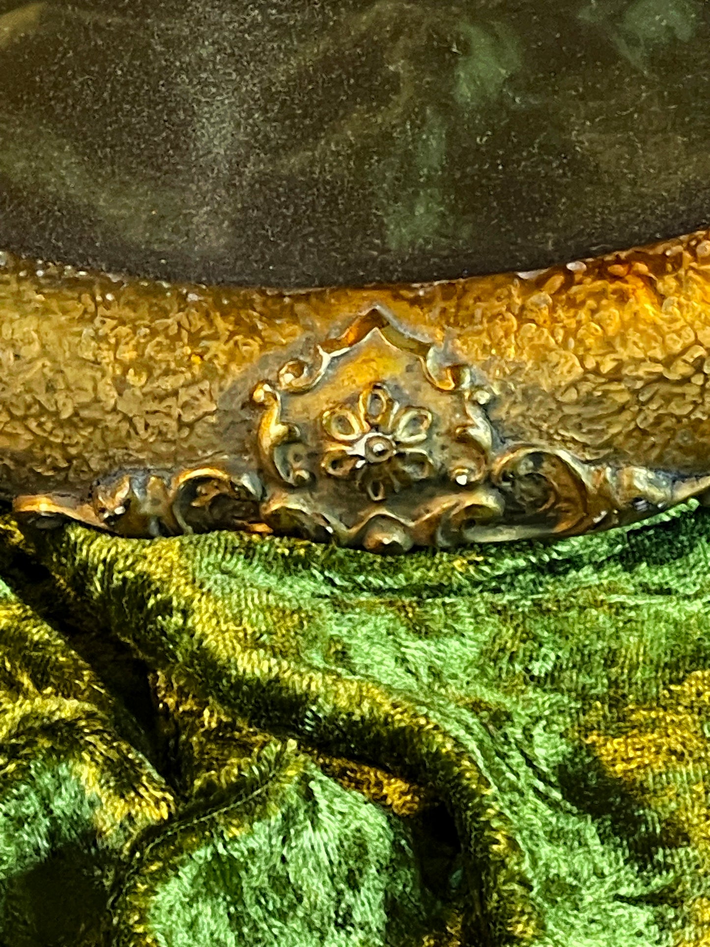 Upper section of the oval frame with decorative cresting