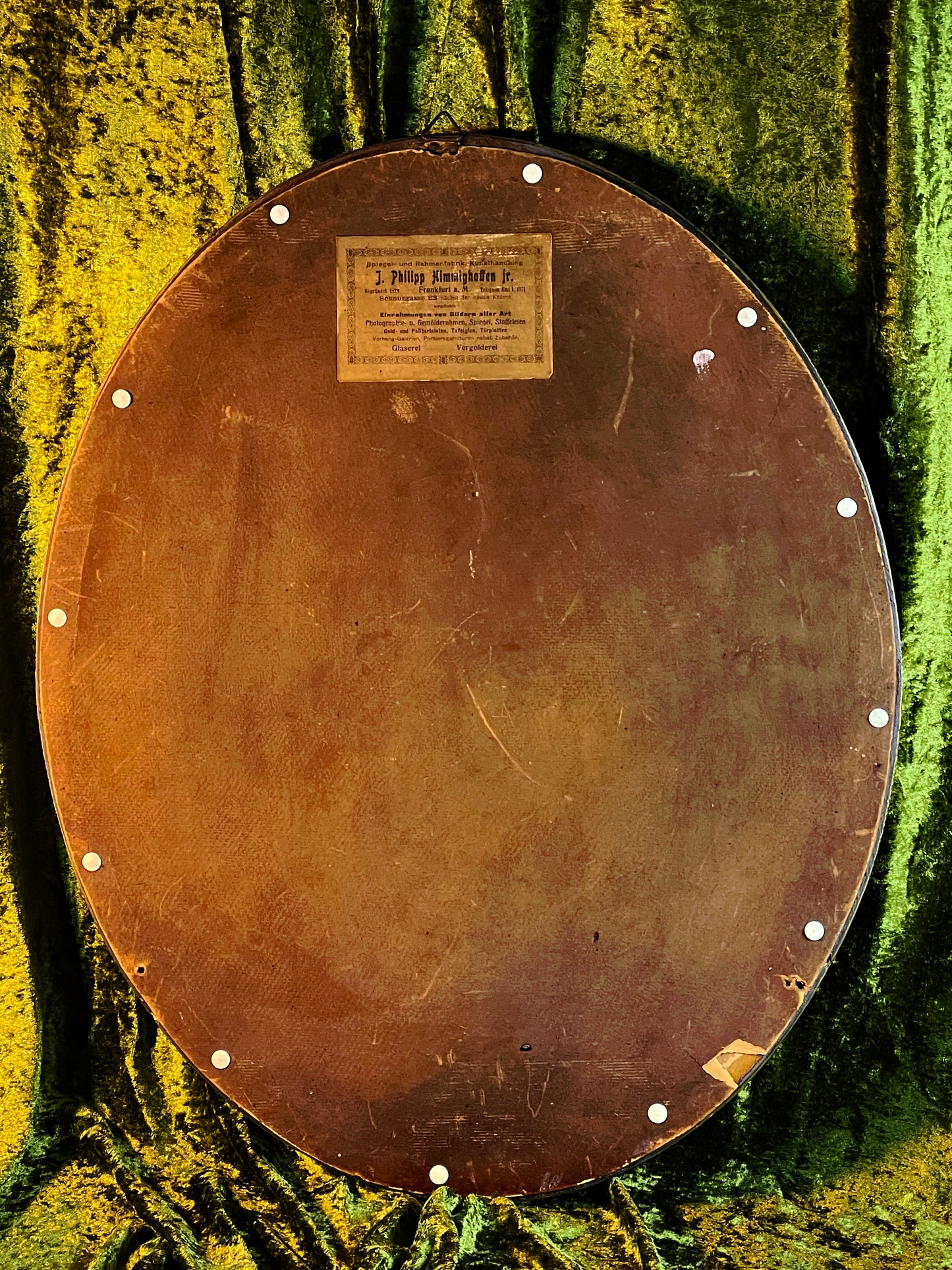 Lower section of the oval frame ornament detail