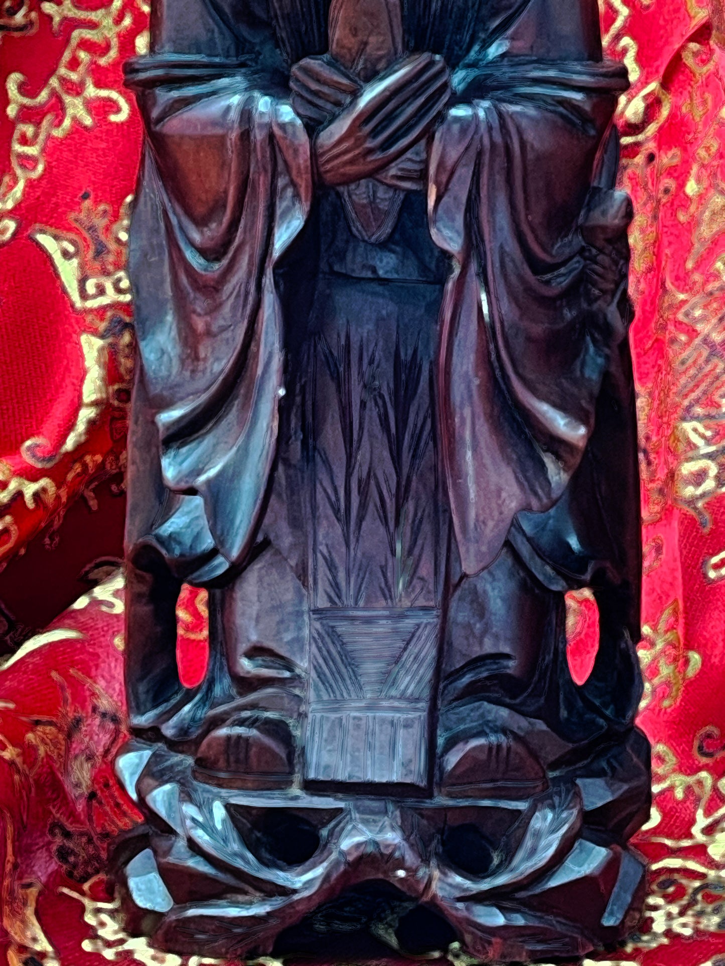 Side profile of carved Confucius hardwood sculpture