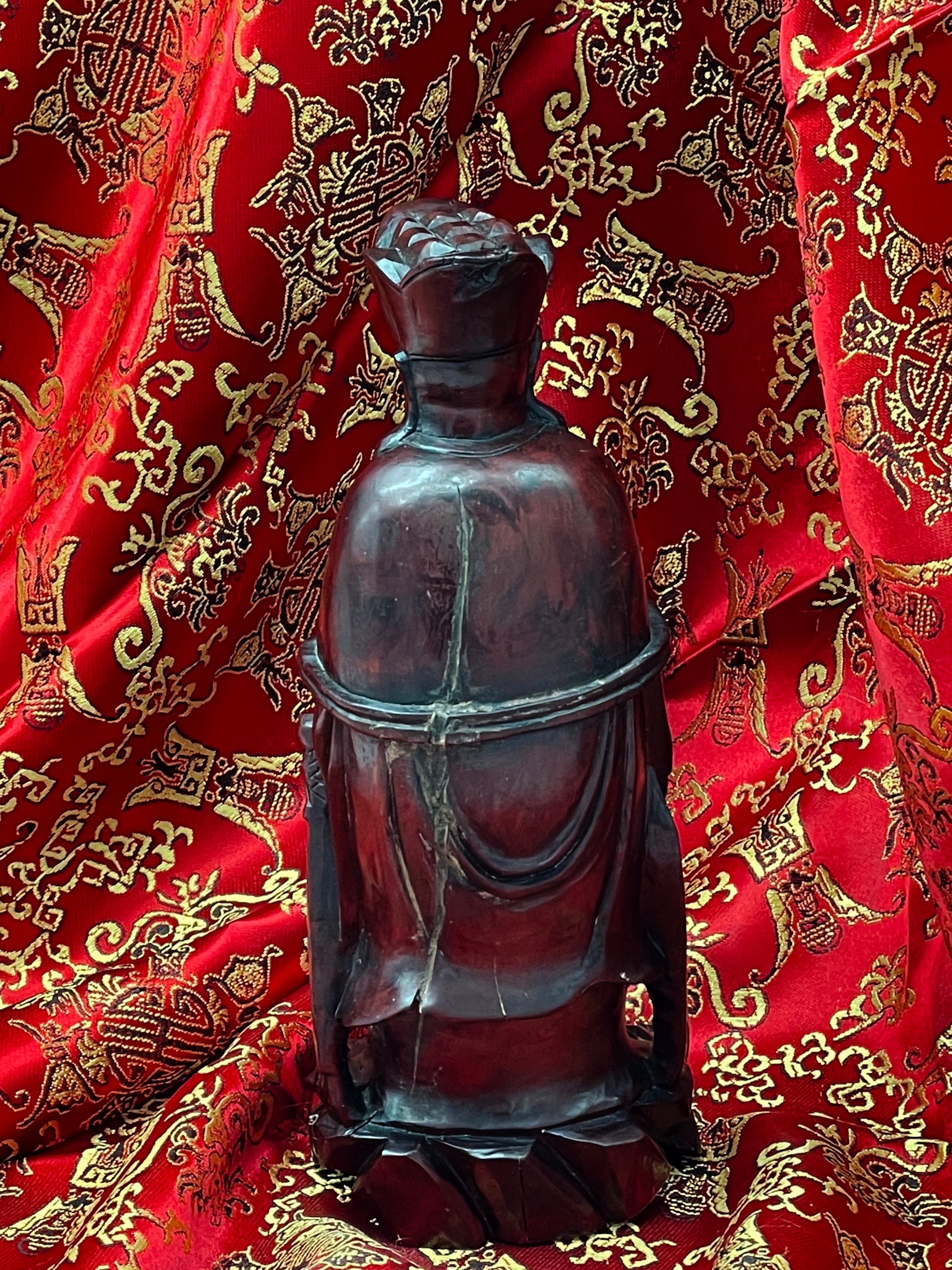Rear view of antique Chinese Confucius wood carving