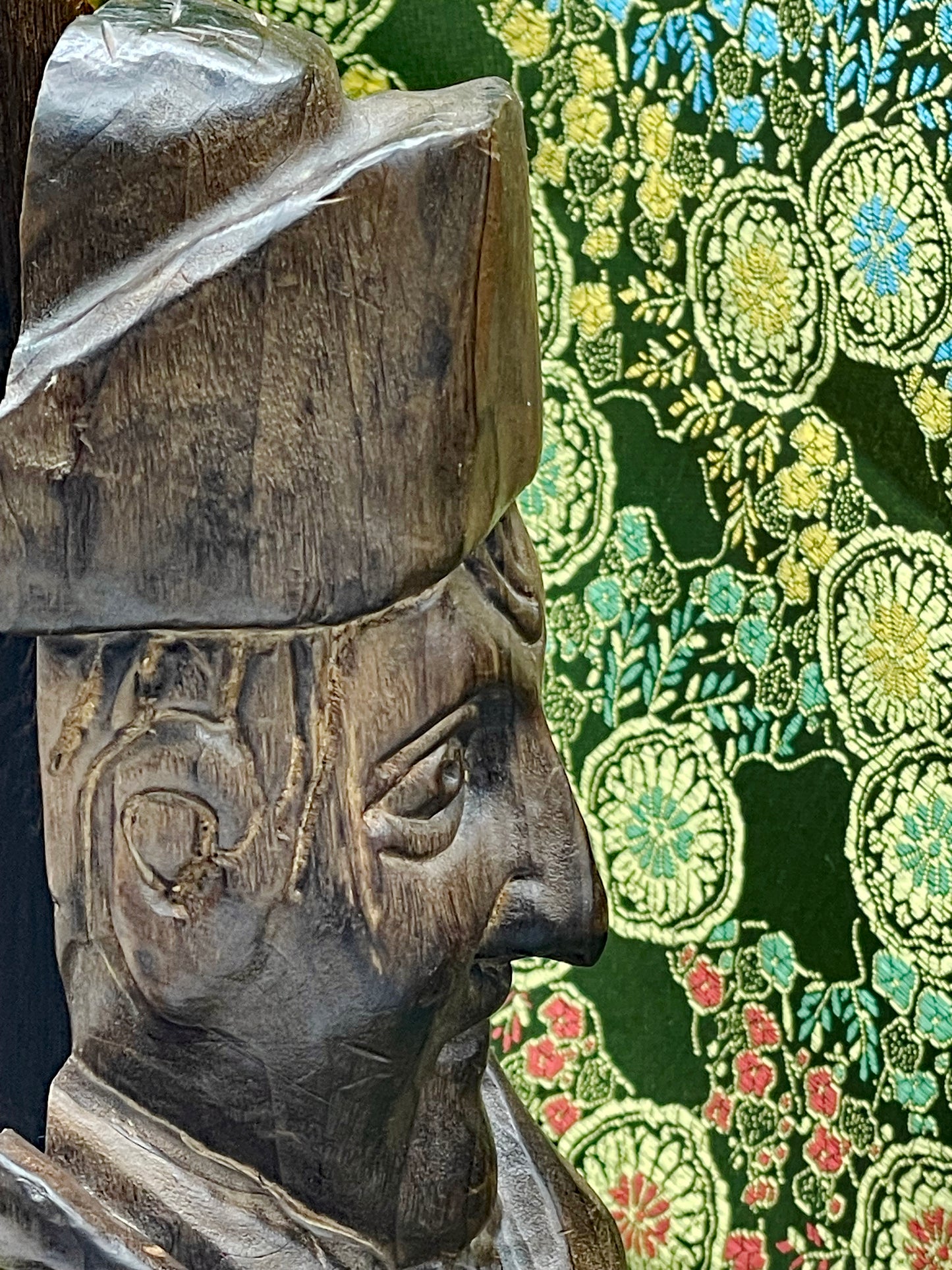 Carved Napoleon bottle holder showing magnetic closure