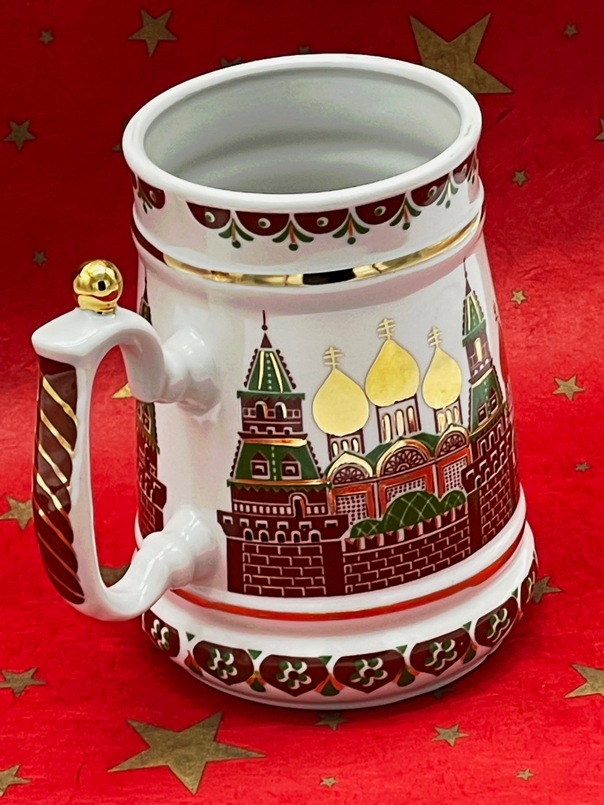 Side view of Russian porcelain tankard with onion domes