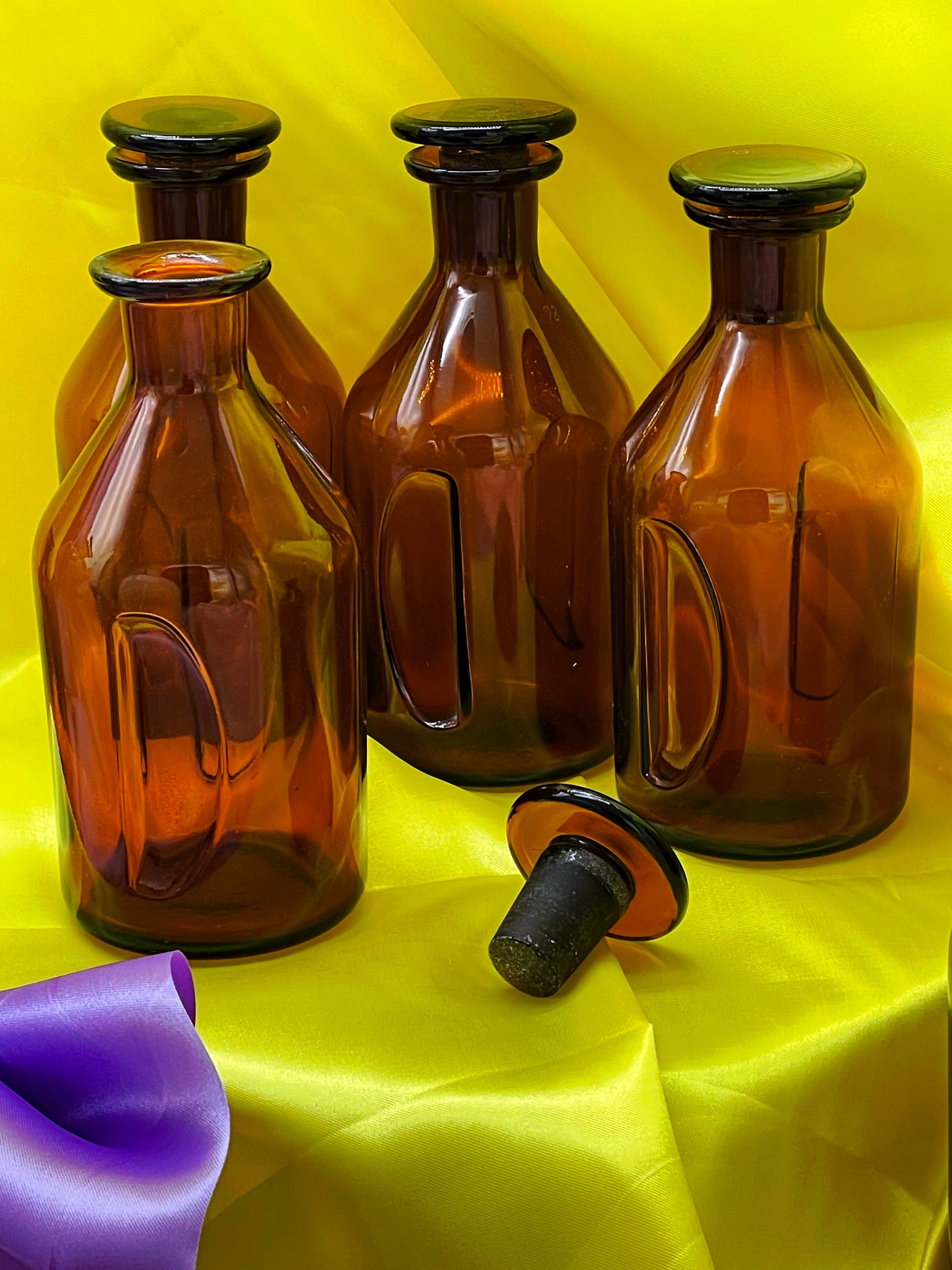 Vintage German apothecary glass bottles arranged together