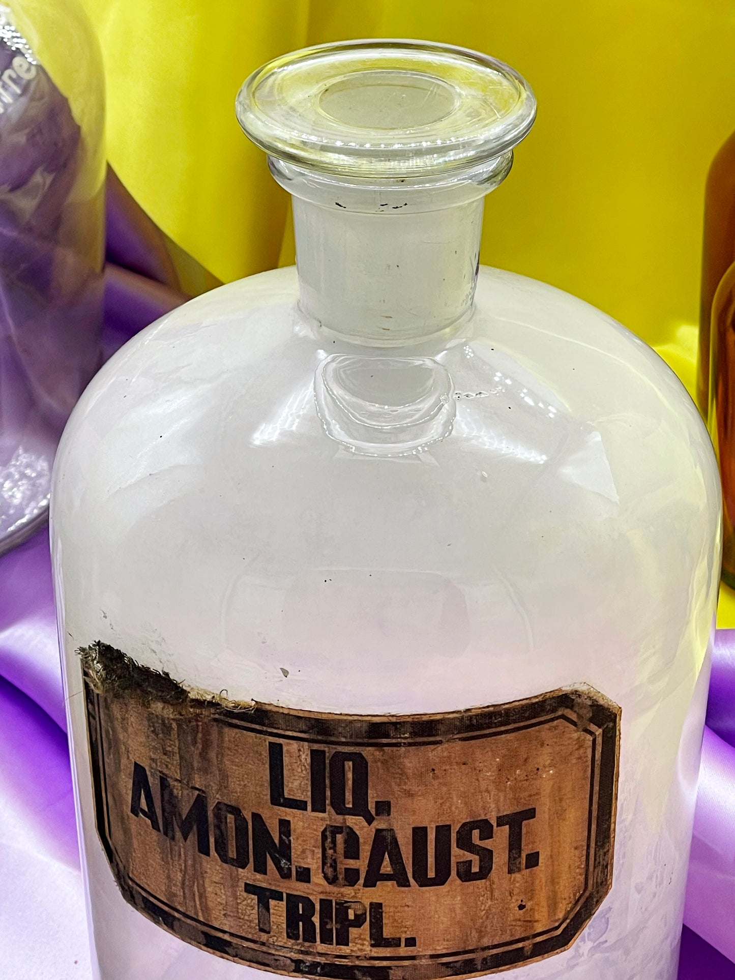 Vintage laboratory glass bottle with original paper label