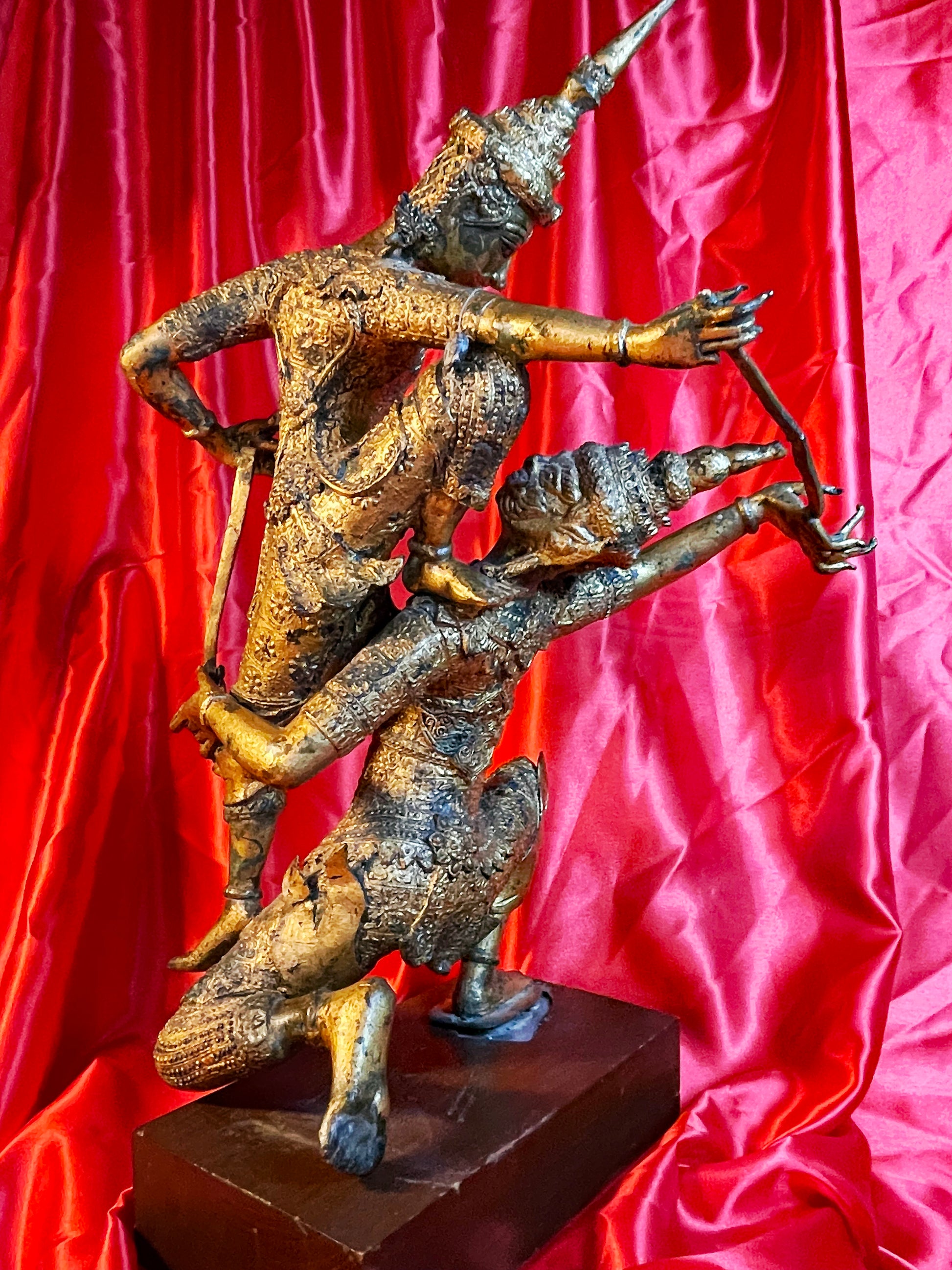 Thai gilt bronze guardians sculpture viewed from the side