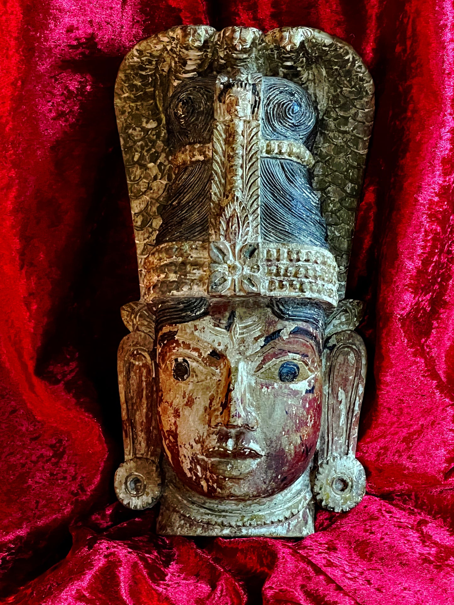 Naga deity mask front view with towering cobra crown and Kirtimukha face
